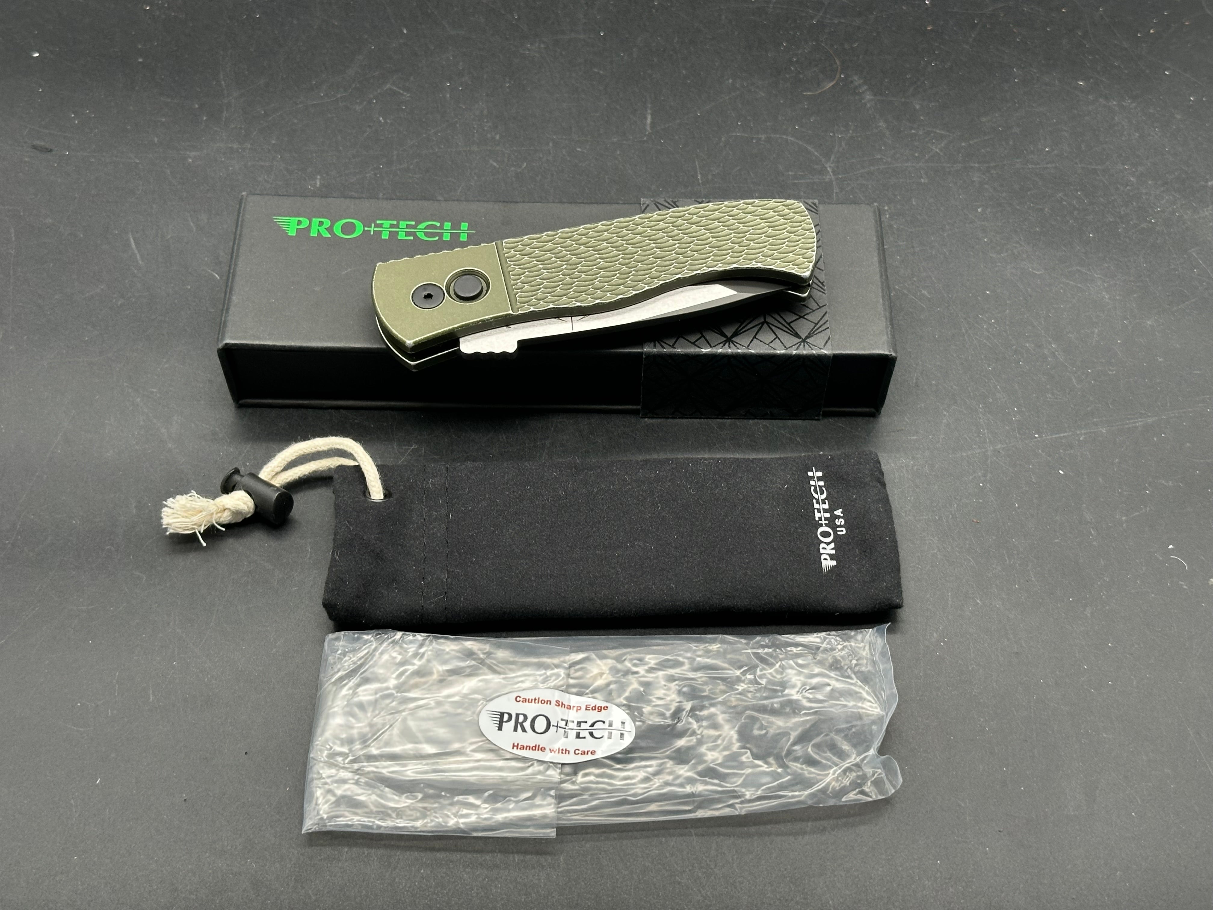 ProTech Emerson Auto CQC-7 Green battle worn textured handle with two tone black/satin blade