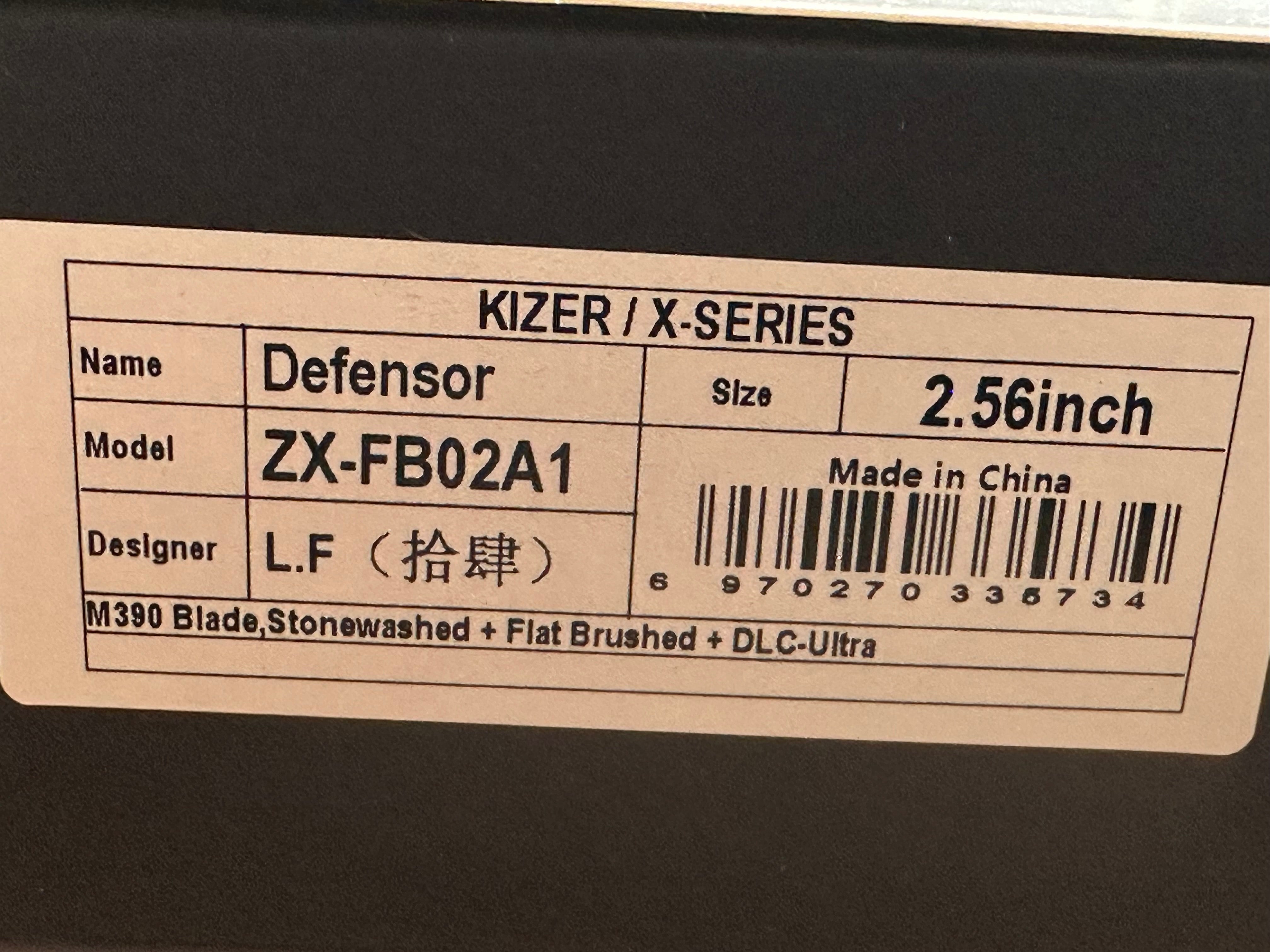 KIZER DEFENSOR M390 HANDLE/BLADE M390 SPEAR POINT PARTIALLY SERRATED EDGE