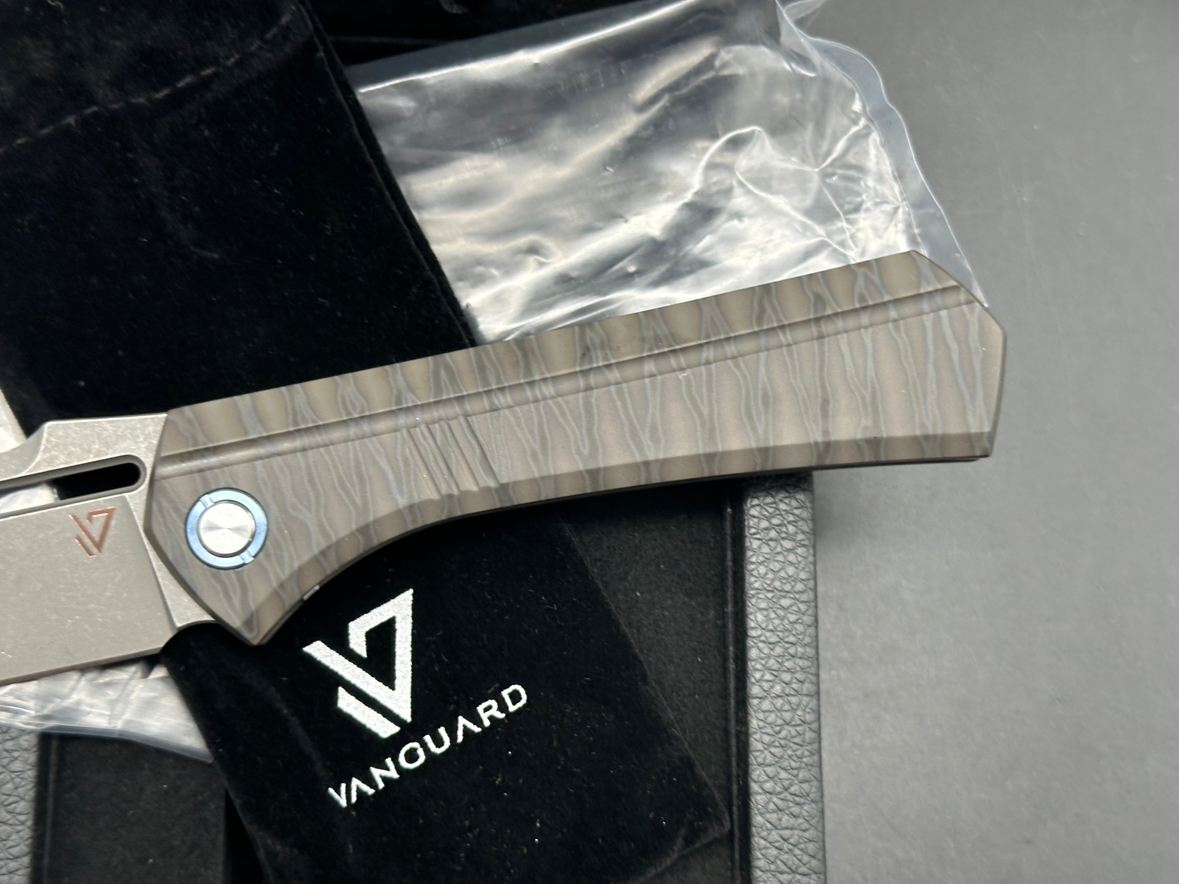 Vanguard Continuum, Dark Stonewashed M390 Blade, Flame Anodized Titanium Handles, Dark Blasted Titanium Backspacer and Pocket Clip