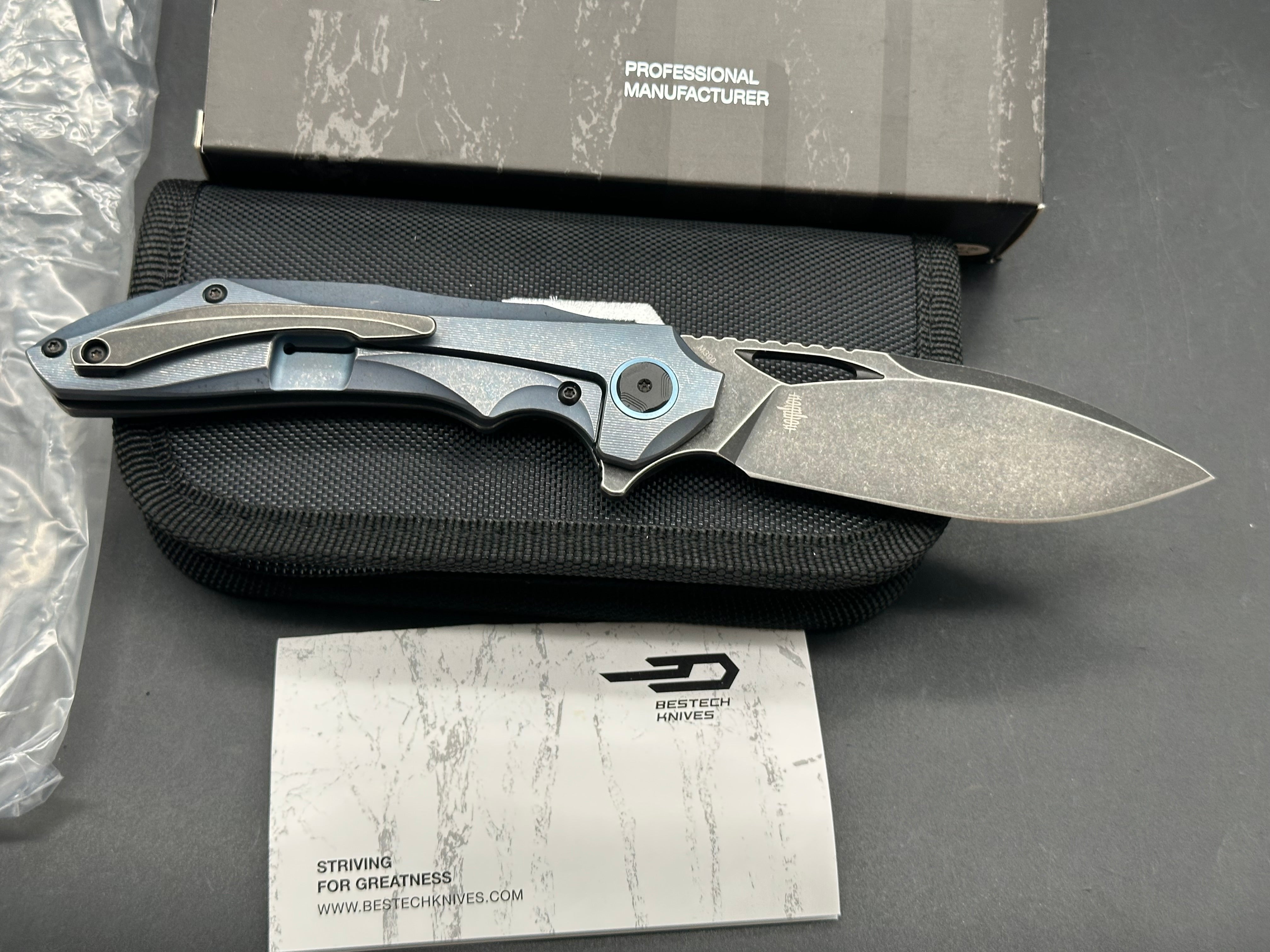 Bestech Eskra (BT1813B), Black Stonewashed M390 Blade, Contoured Blue Anodized Titanium Handles with Micro Milling