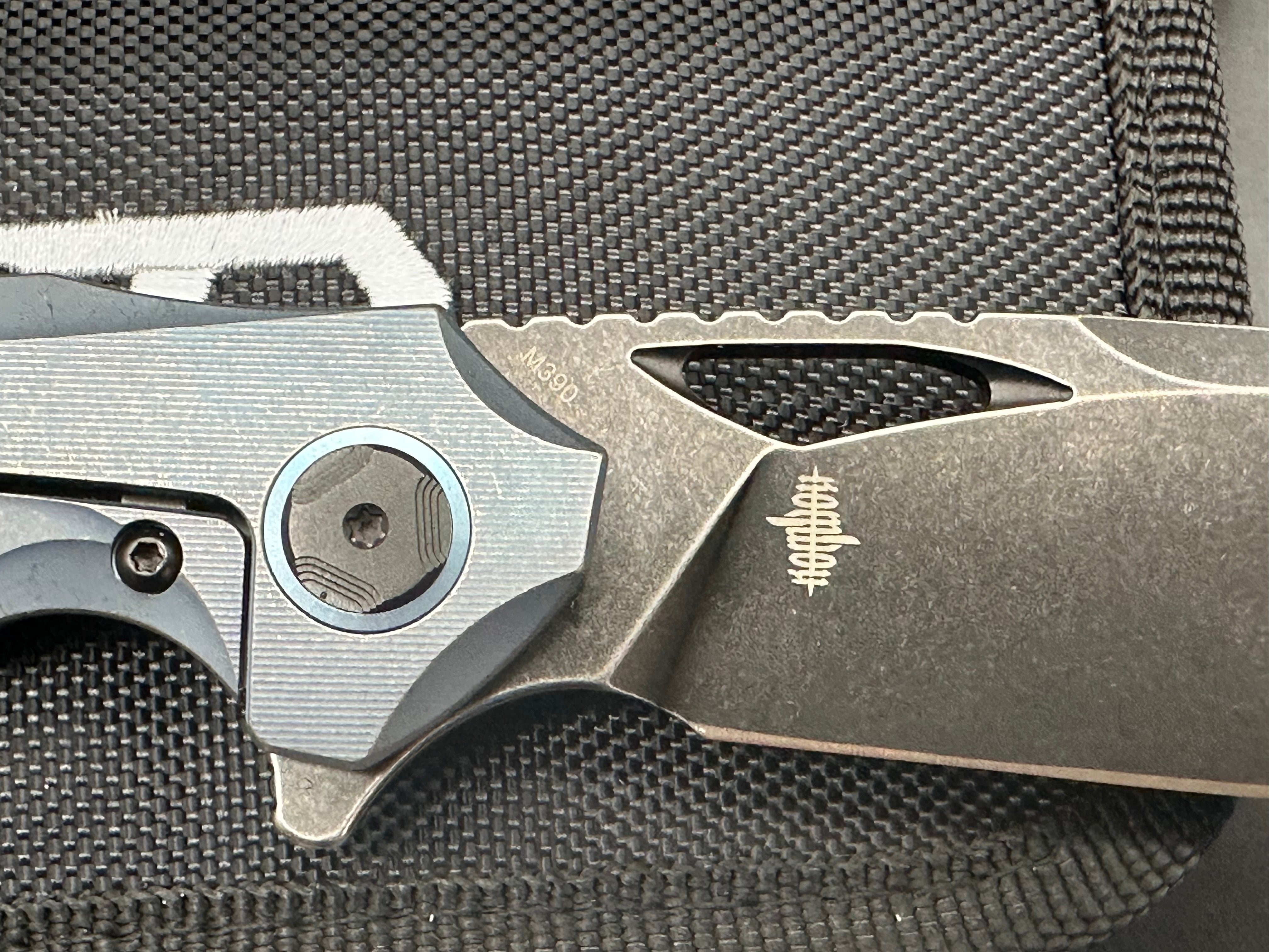 Bestech Eskra (BT1813B), Black Stonewashed M390 Blade, Contoured Blue Anodized Titanium Handles with Micro Milling