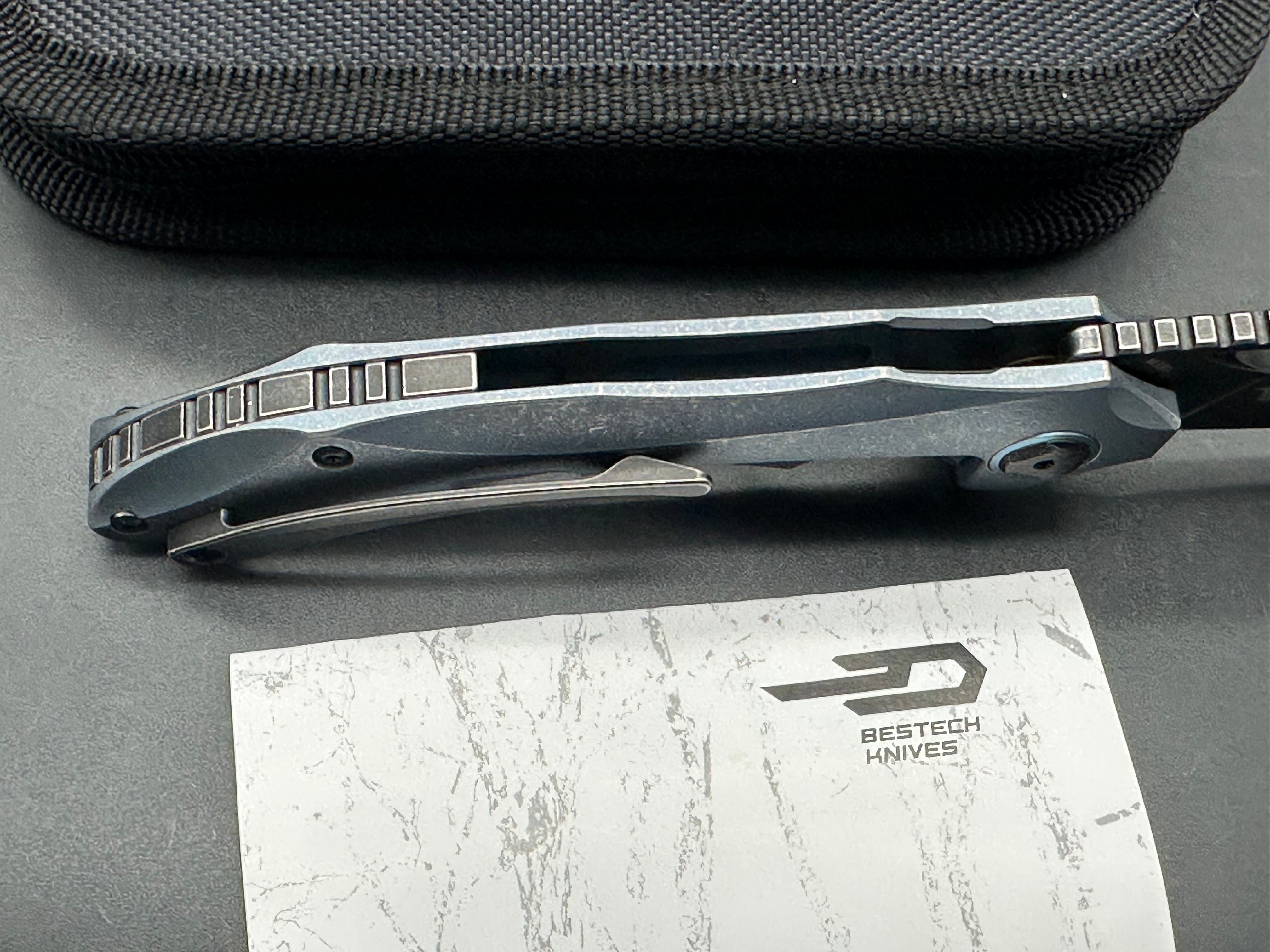 Bestech Eskra (BT1813B), Black Stonewashed M390 Blade, Contoured Blue Anodized Titanium Handles with Micro Milling