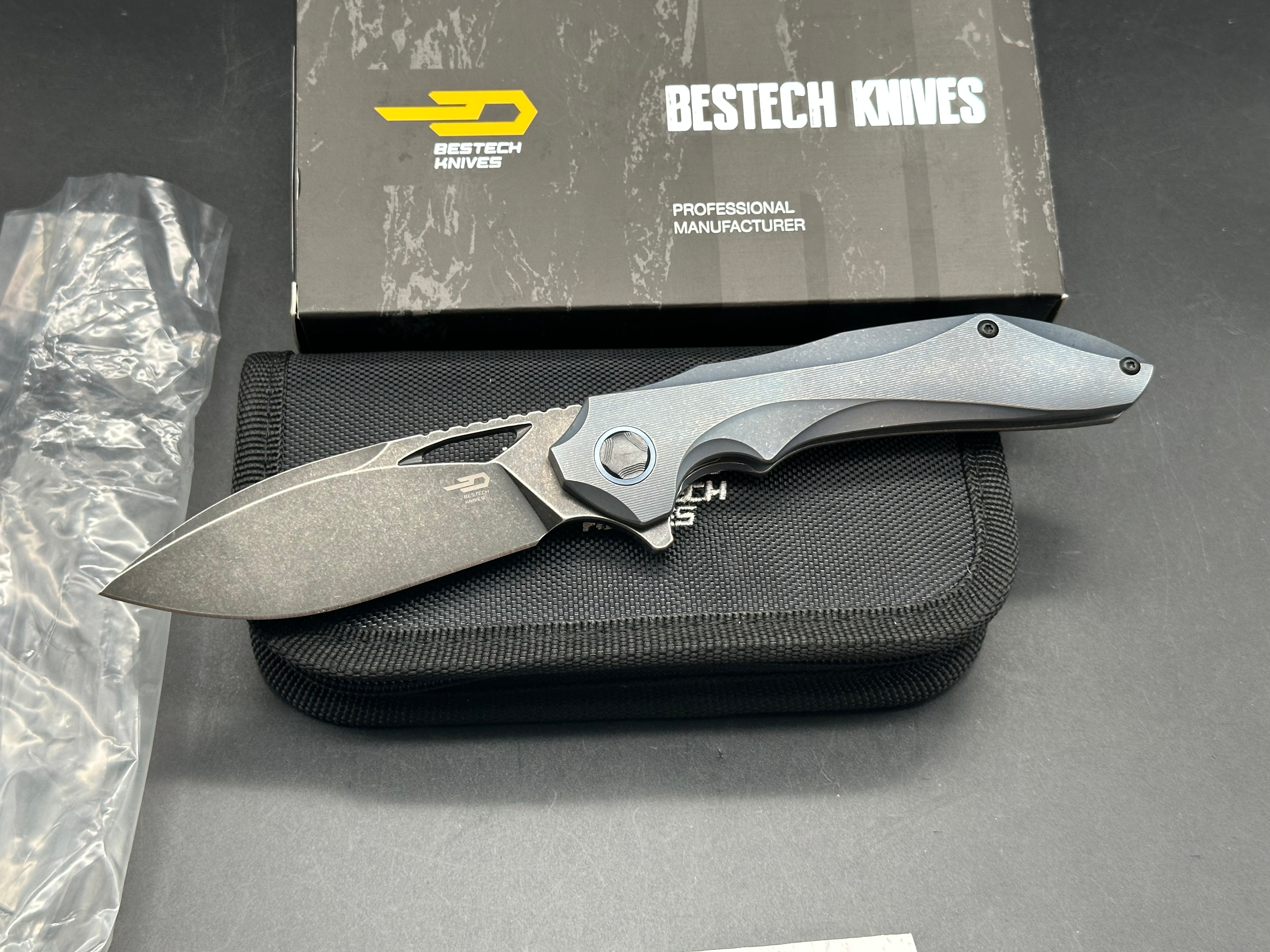 Bestech Eskra (BT1813B), Black Stonewashed M390 Blade, Contoured Blue Anodized Titanium Handles with Micro Milling
