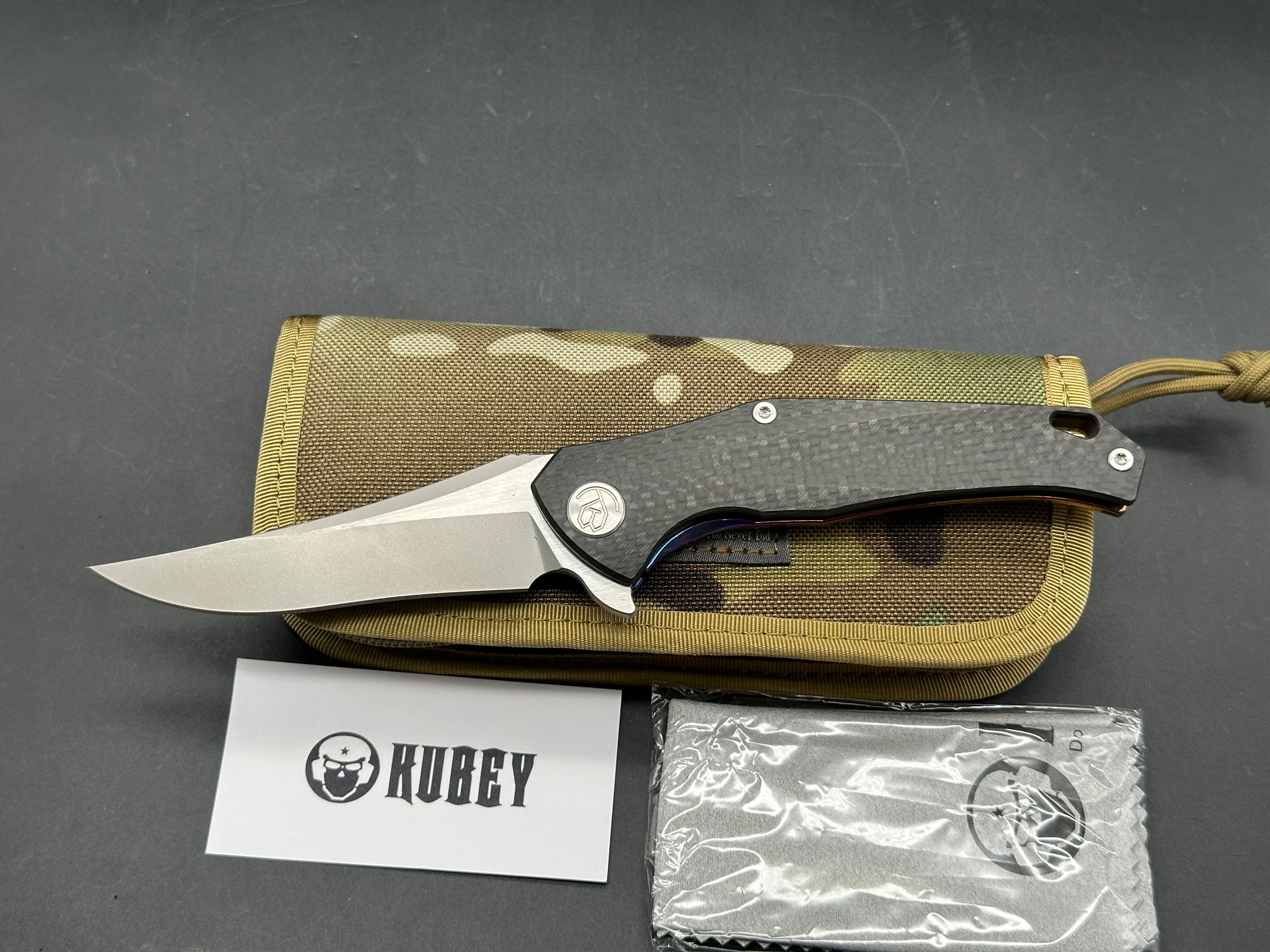 Kubey Caiman colored titanium frame with Carbon Fiber scale