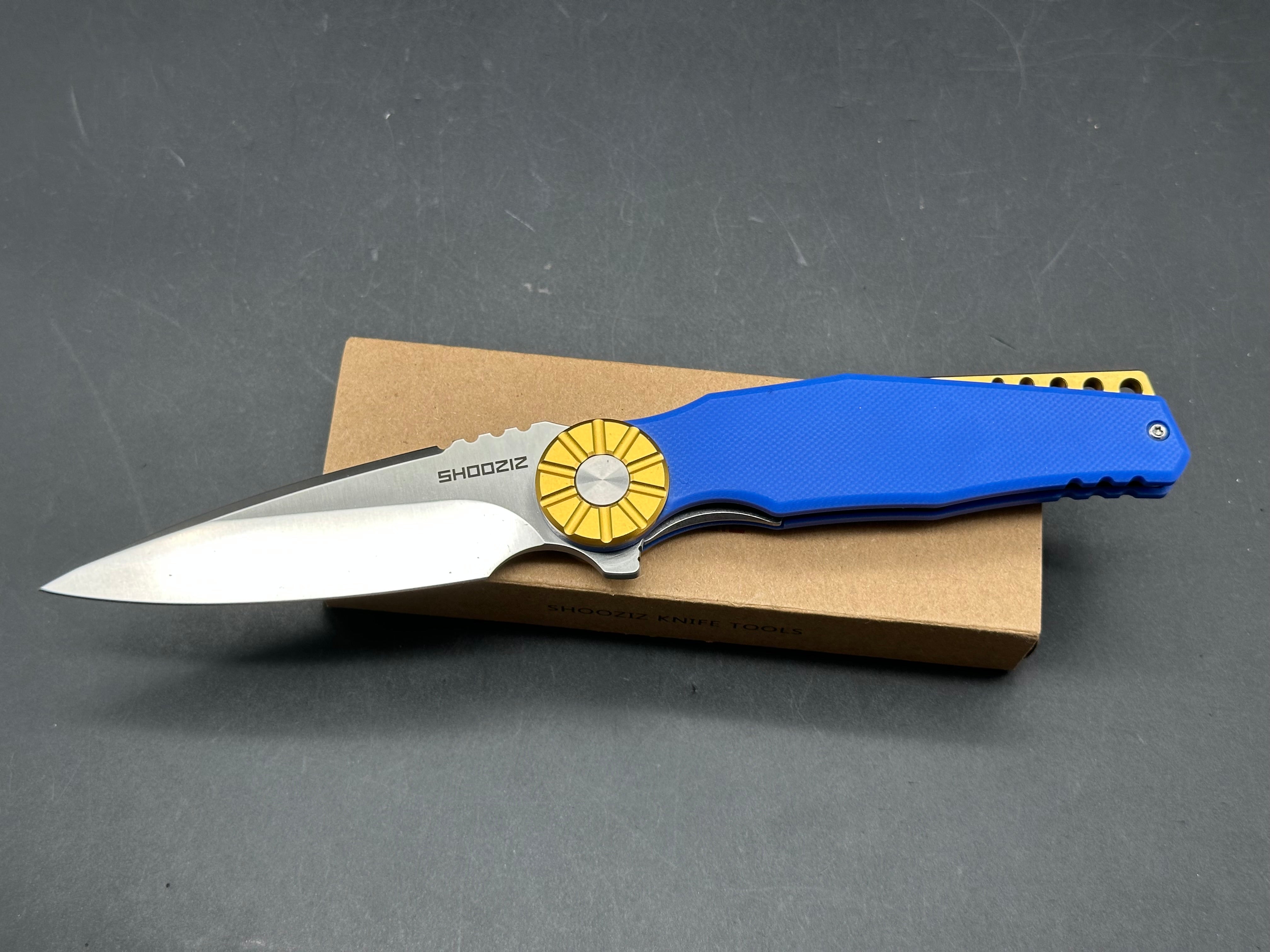 Shooziz Kila DC53 Steel, Aluminum Bolster, Blue G10 Handle