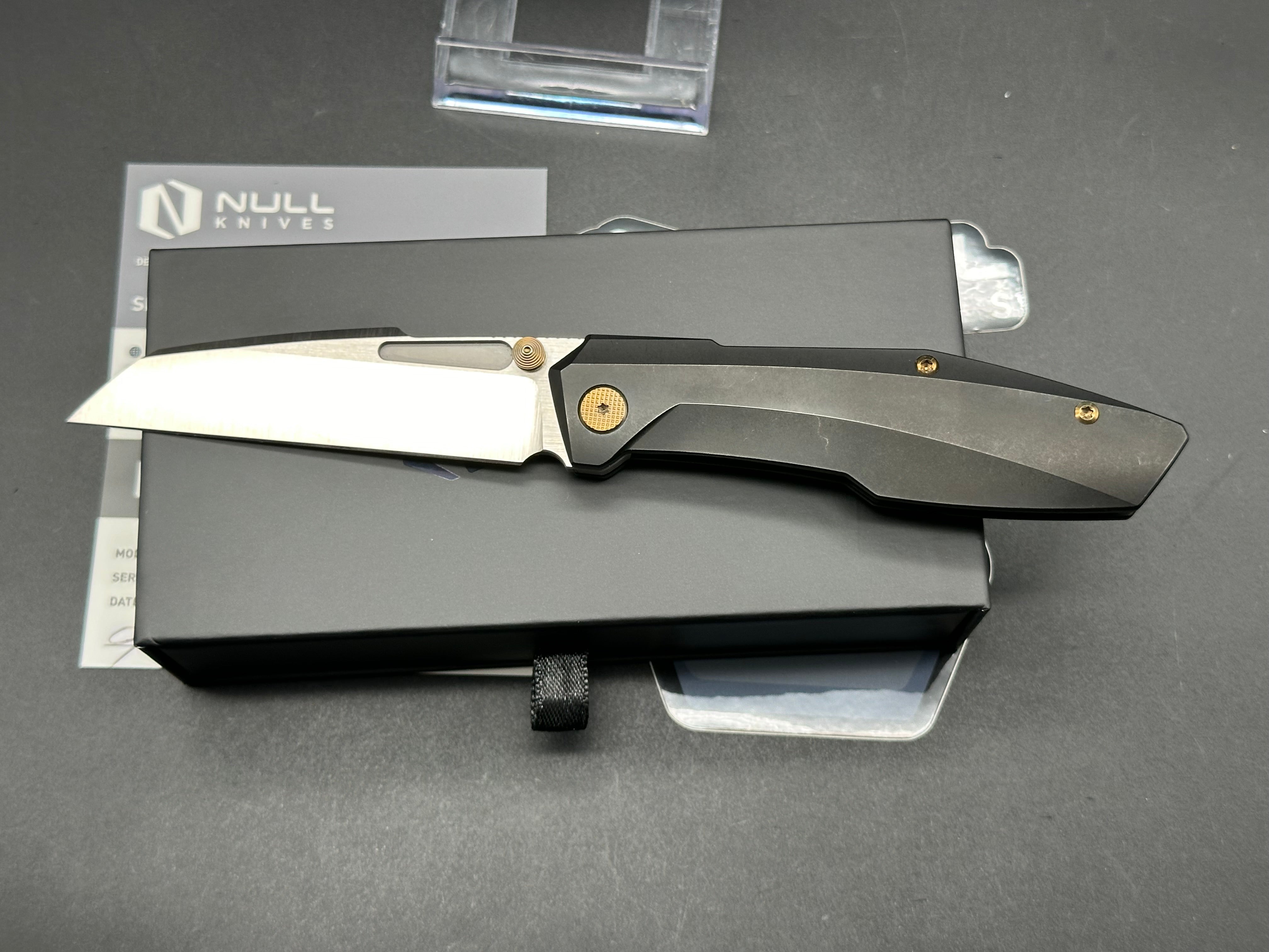 Null Knives Raikou w/black PVD titanium scales with gold hardware and a satin finished S90V blade