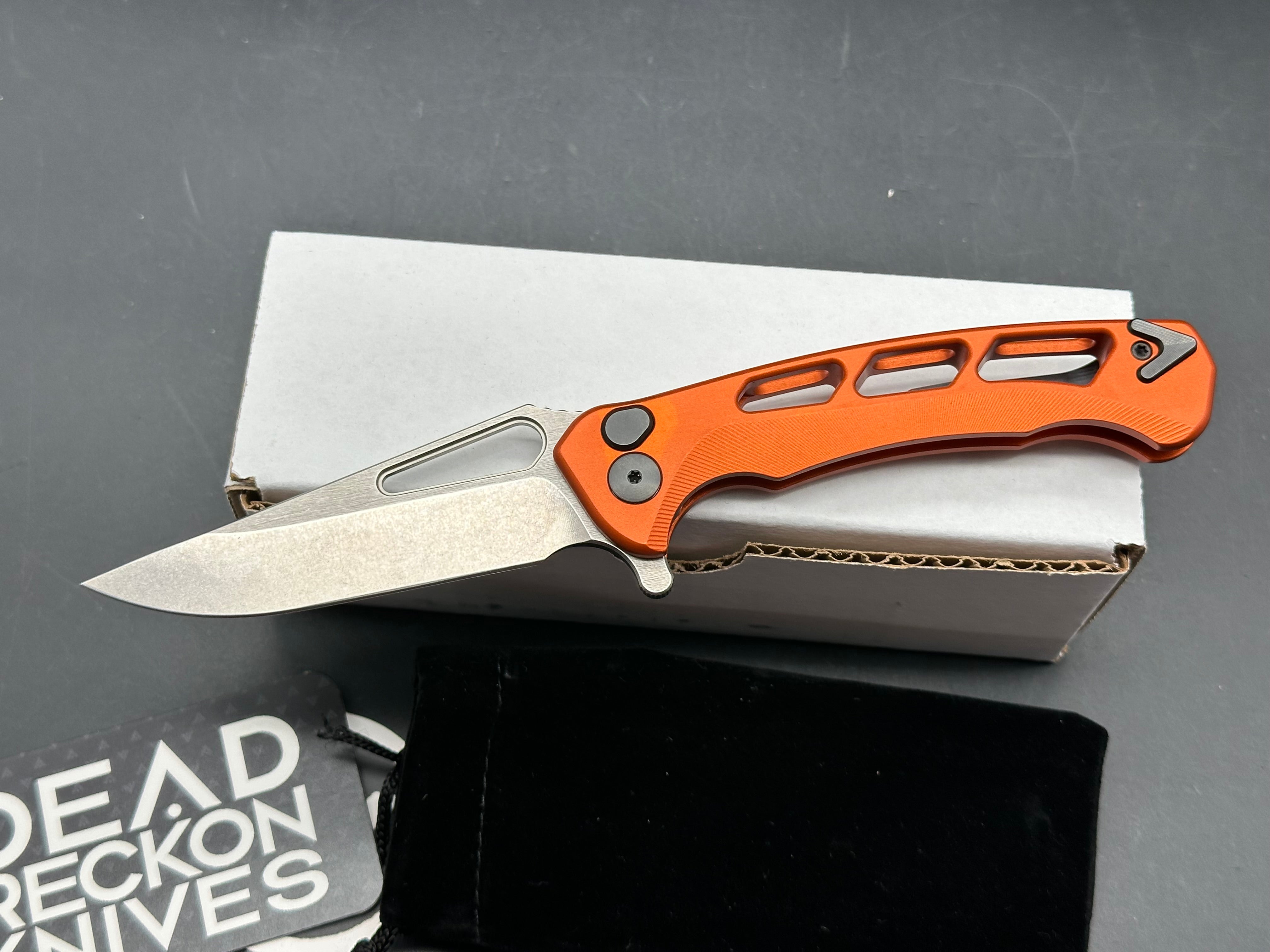 Dead Reckon Knives Ridgeback Integral Vertebrae, 3.42" CPM MagnaCut Stonewash Modified Clip Point Blade with Orange Integral Vertebrae Aluminum Scale