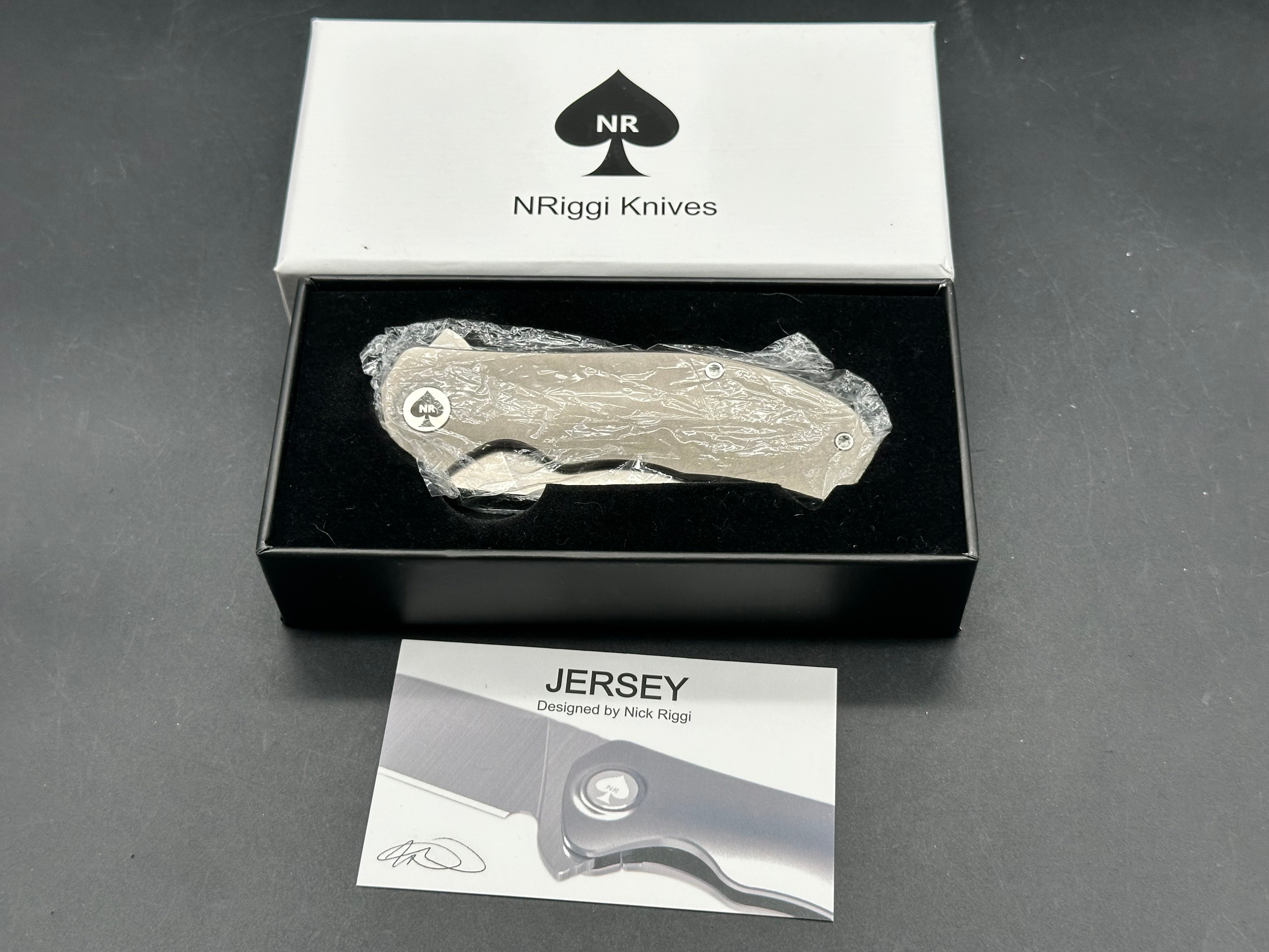 NRiggi Knives "JERSEY" Laser Engraved Wave Titanium Scales w/CPM 20CV bead blast blade