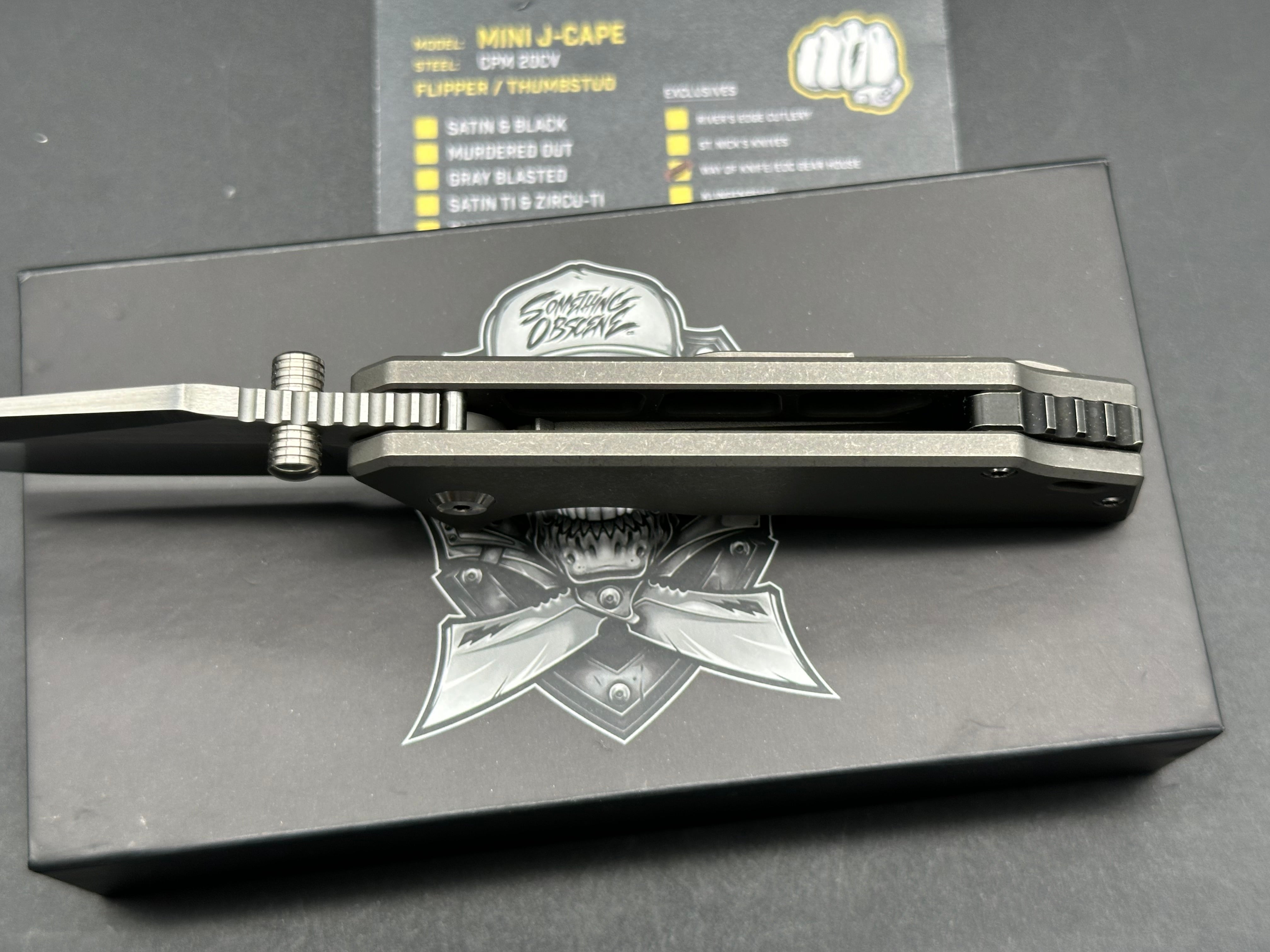 Something Obscene Mini J Cape Thumbstud Black / Satin Blade