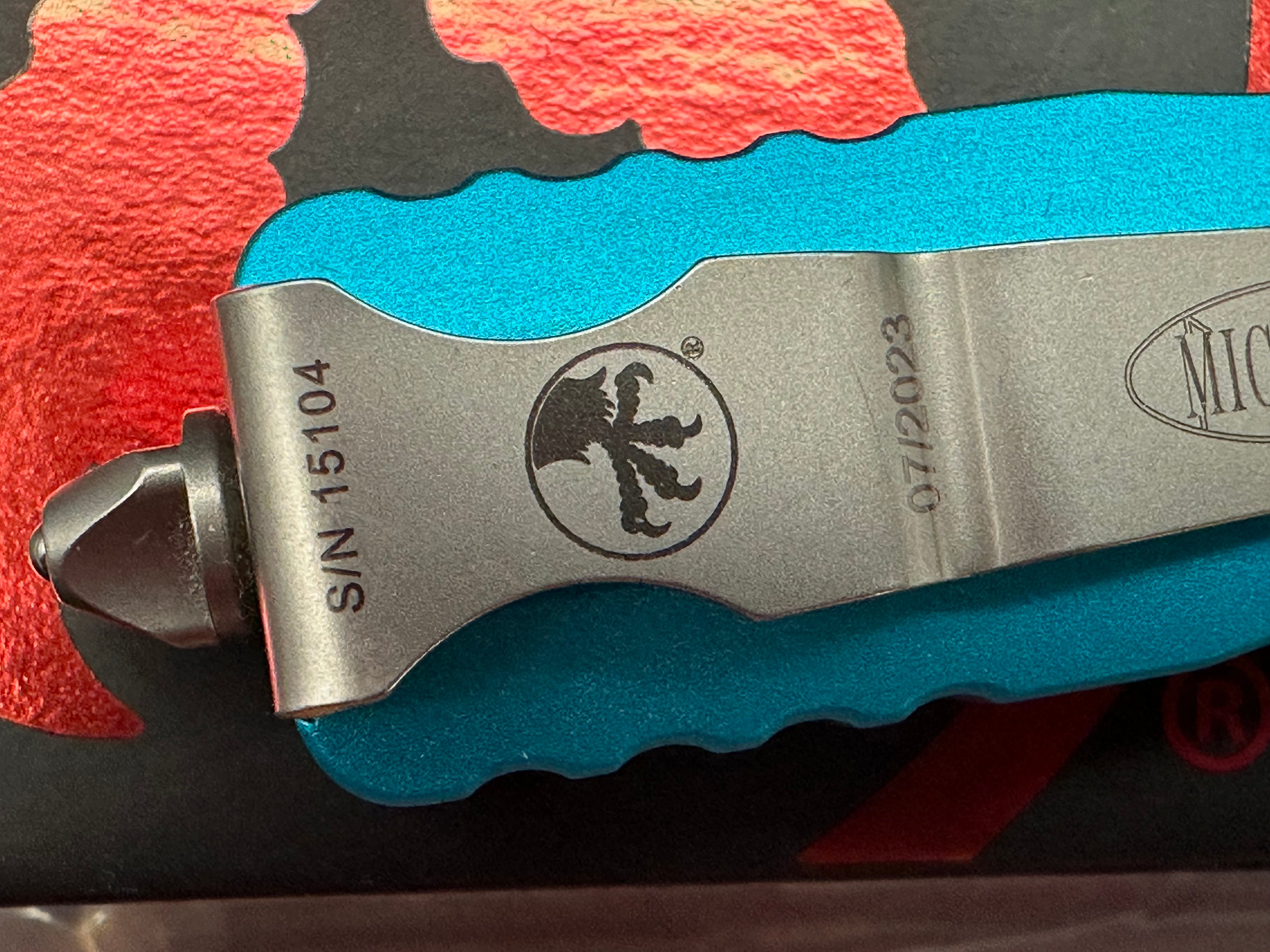 Microtech 225-11TQ Dirac AUTO OTF Knife 2.92" Stonewashed Double Combo Edge Dagger Blade, Turquoise Aluminum Handles
