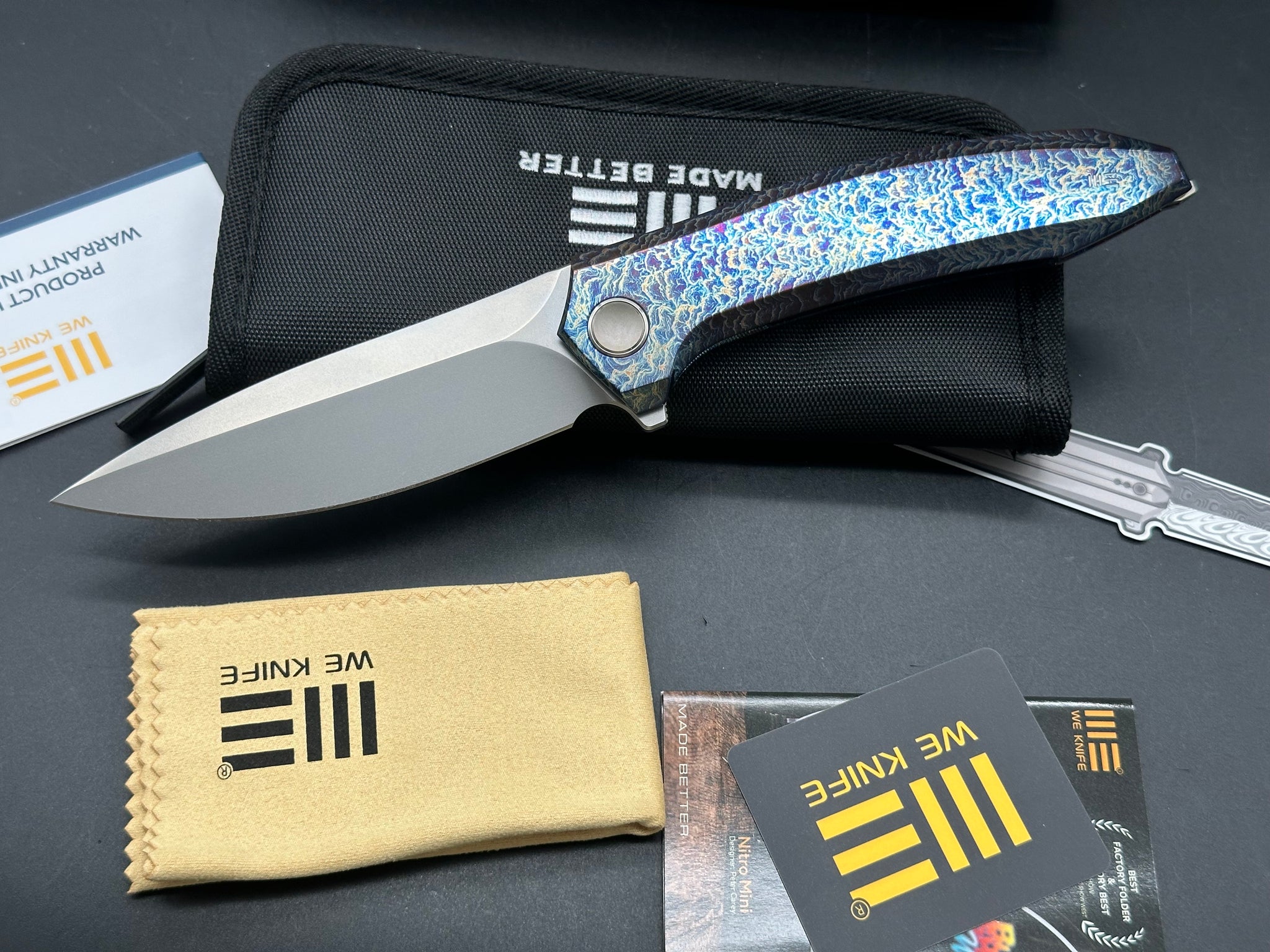 WE ACUMINAL FOLDING KNIFE FLAMED TITANIUM HANDLE VANAX PLAIN EDGE POLI