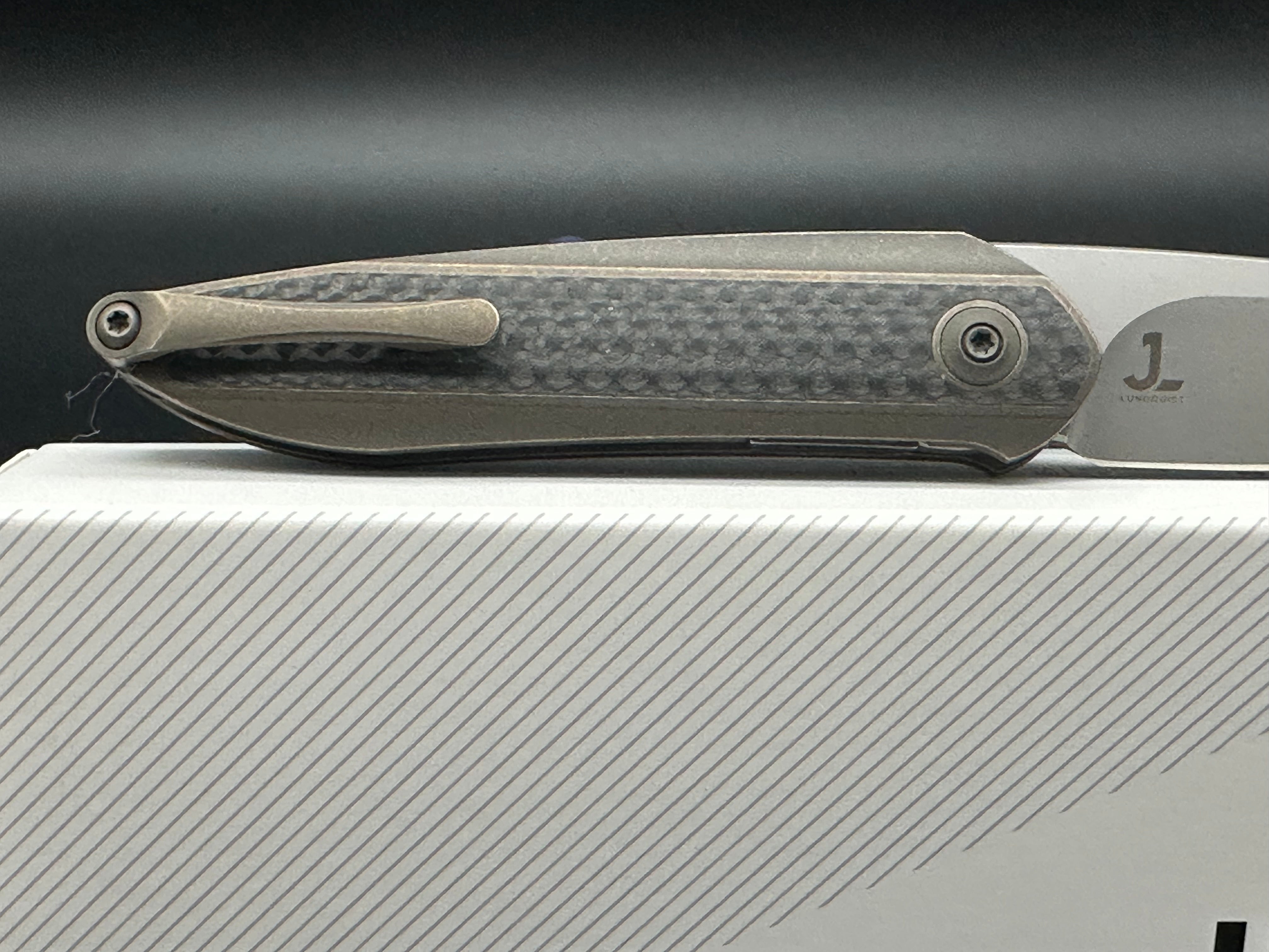 WE Black Void Opus Bronze Handle with twill carbon fiber inlay CPM 20CV