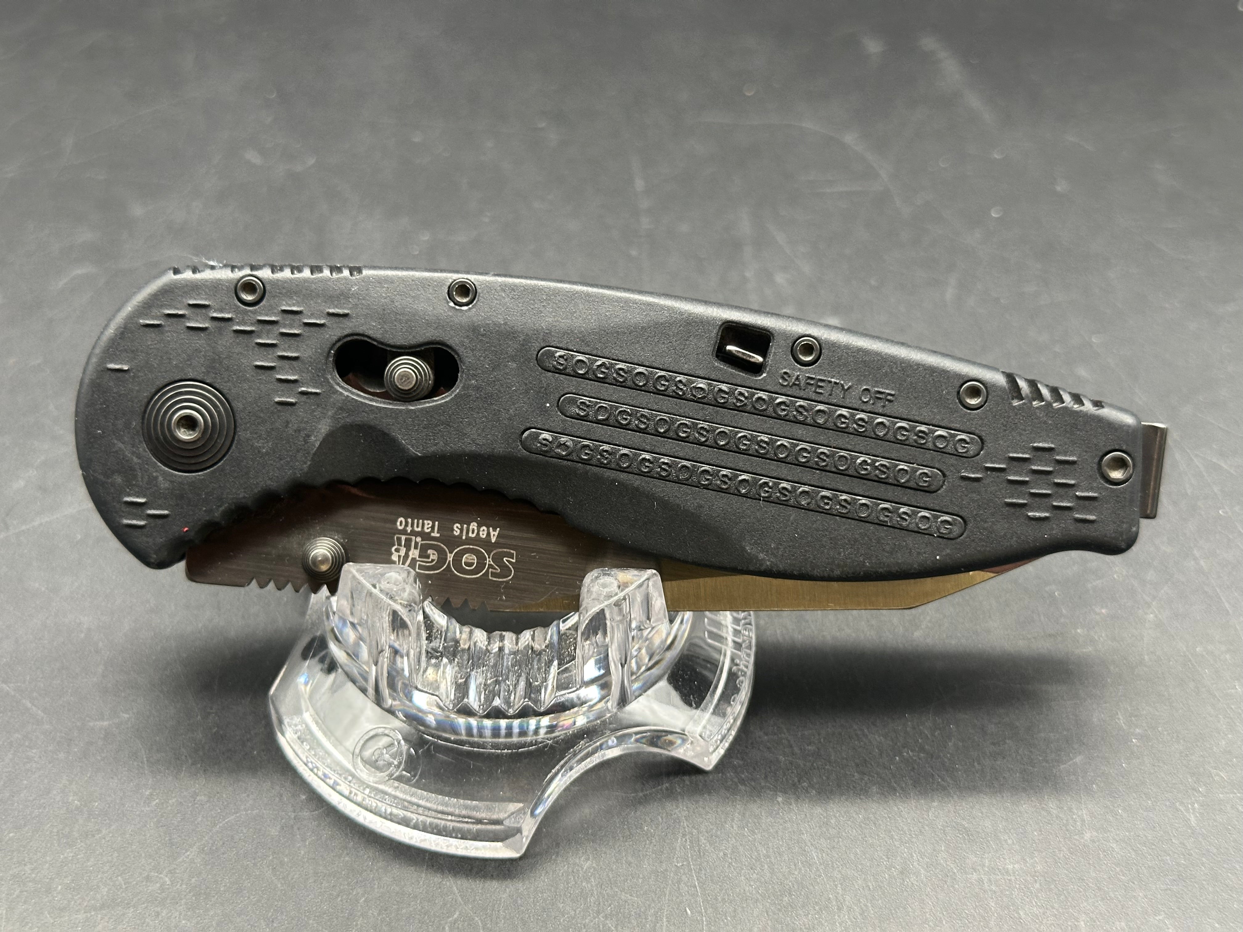 SOG Aegis Folding Knife Assisted 3.5" Black TiNi Combo Tanto Blade, Black GRN Handles, Arc-Lock