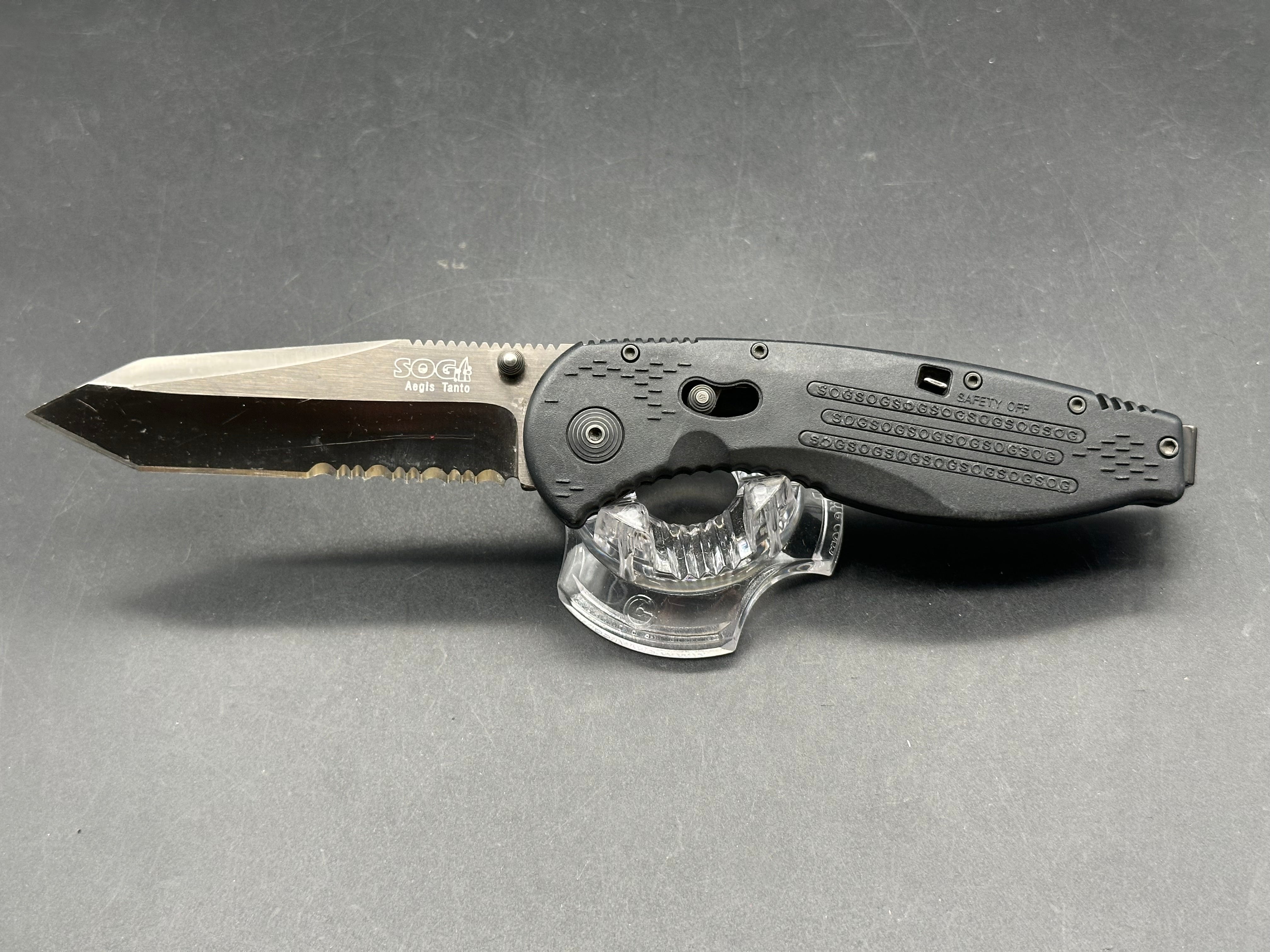 SOG Aegis Folding Knife Assisted 3.5" Black TiNi Combo Tanto Blade, Black GRN Handles, Arc-Lock