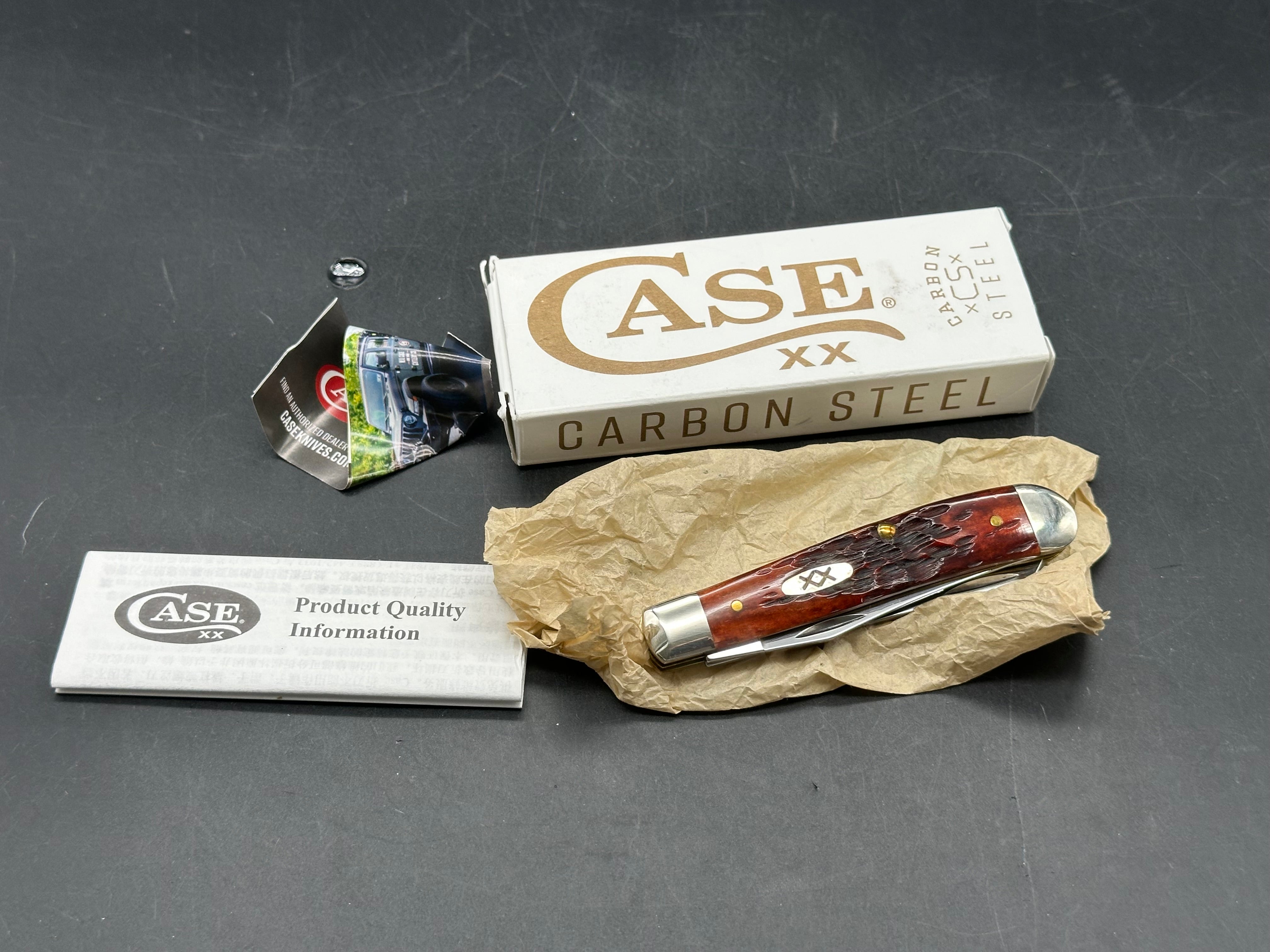 Case Mini Trapper mahogany bone peach seed milling on bone