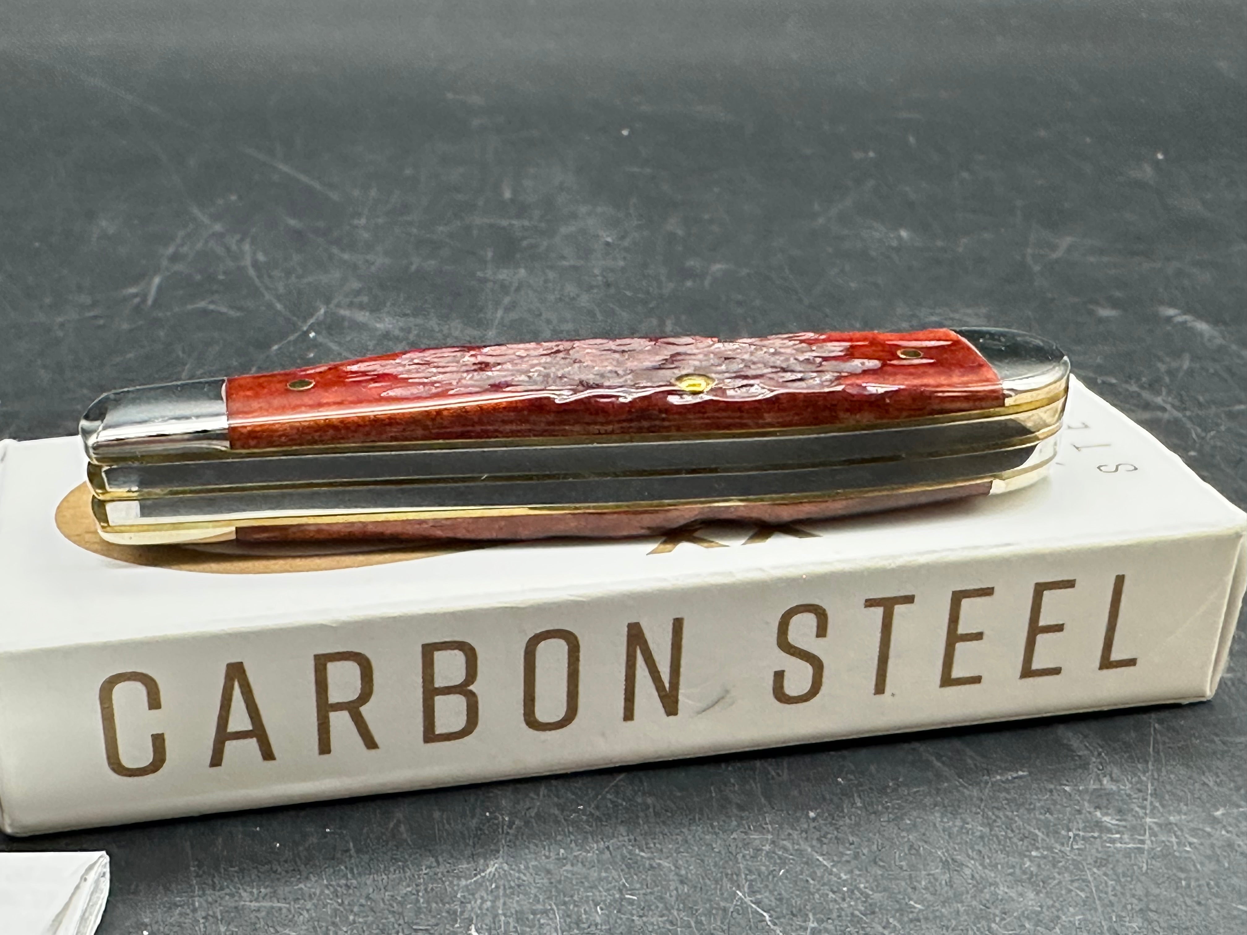 Case Mini Trapper mahogany bone peach seed milling on bone