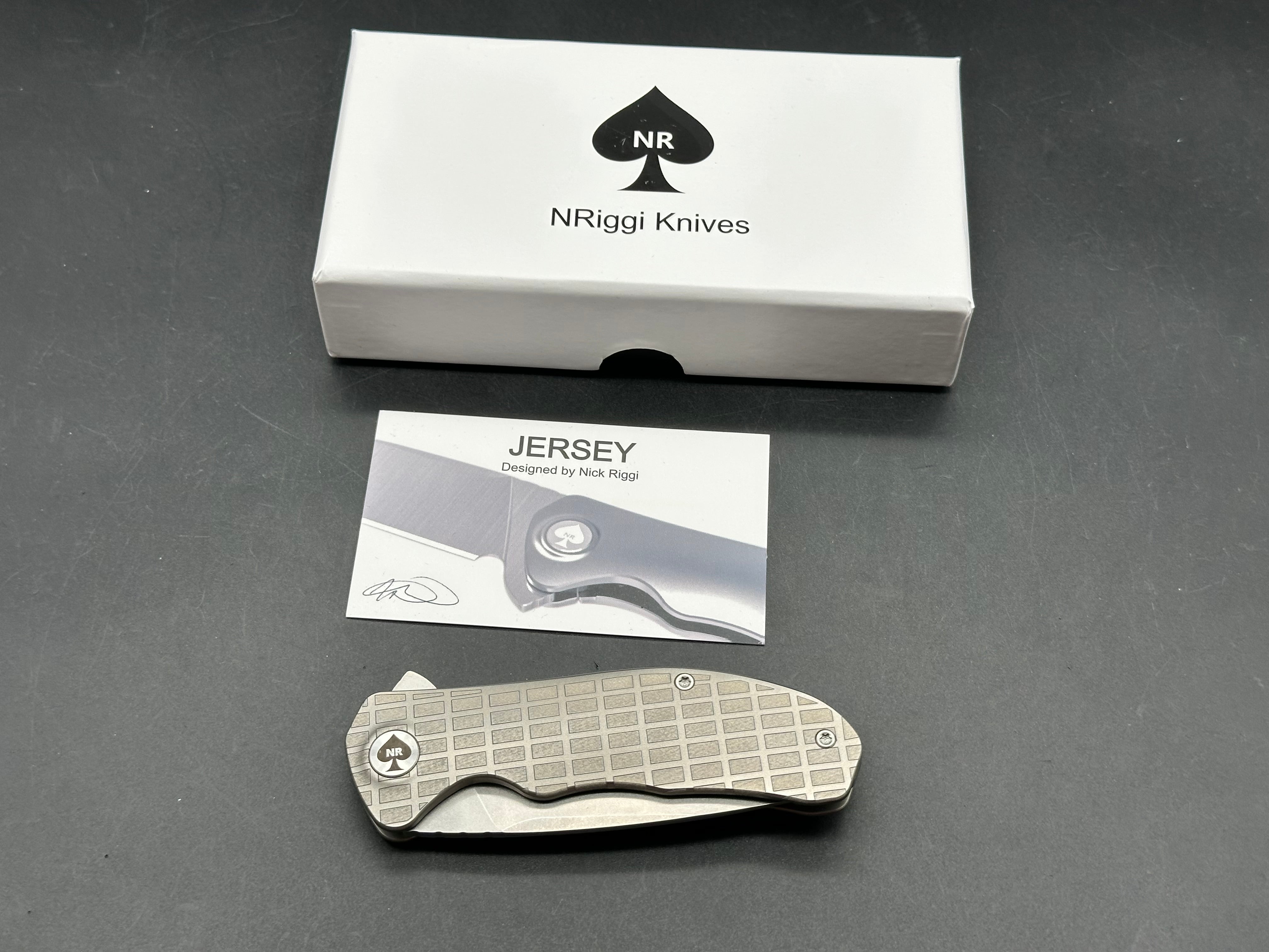 NRiggi Knives "JERSEY" Laser Engraved Titanium Scales w/CPM 20CV stonewash blade (brick pattern)