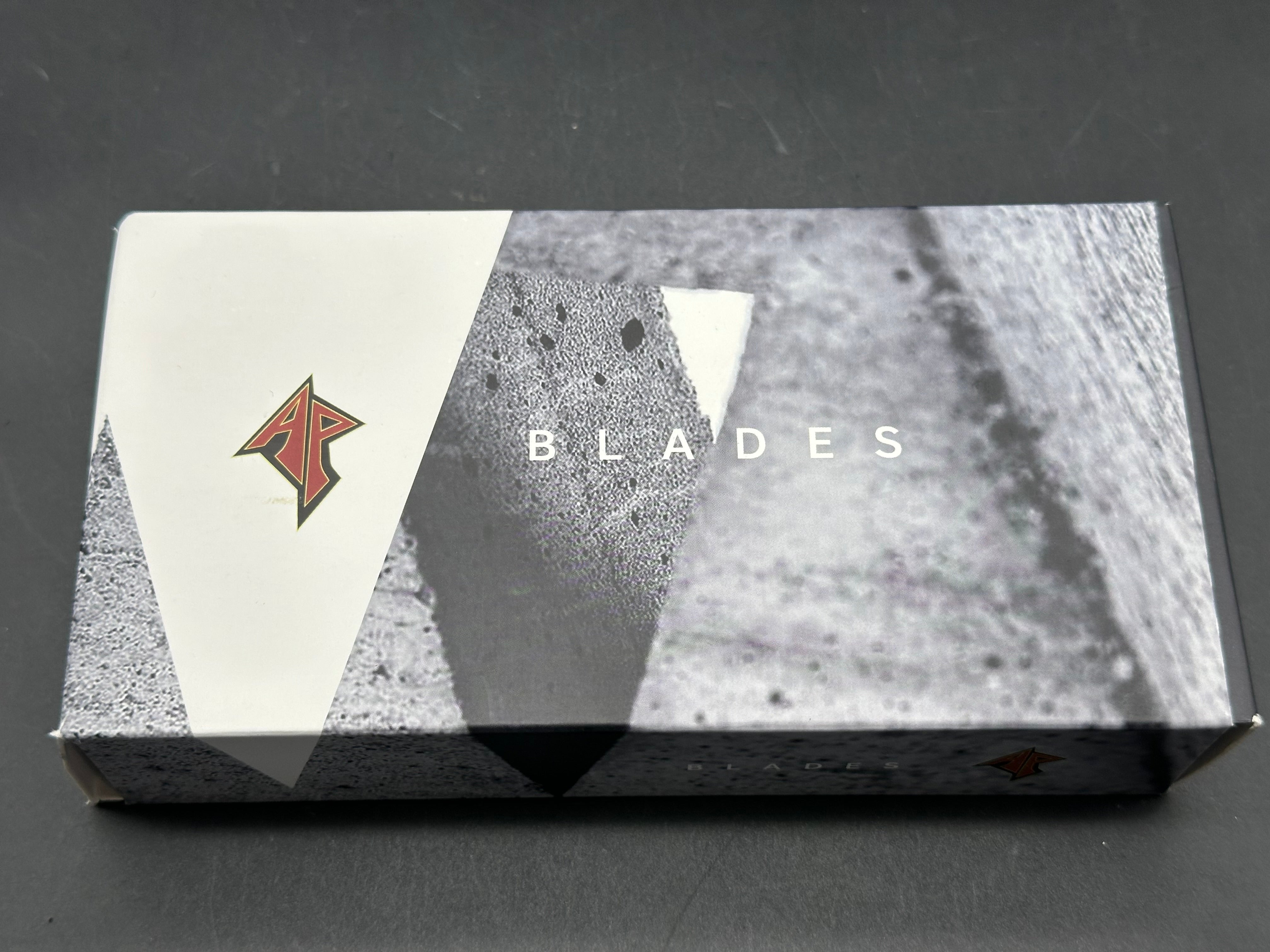 A. Purvis Blades Primordial MK2, Stonewashed M390 Blade Titanium Handles with Marbled Carbon Fiber Overlays