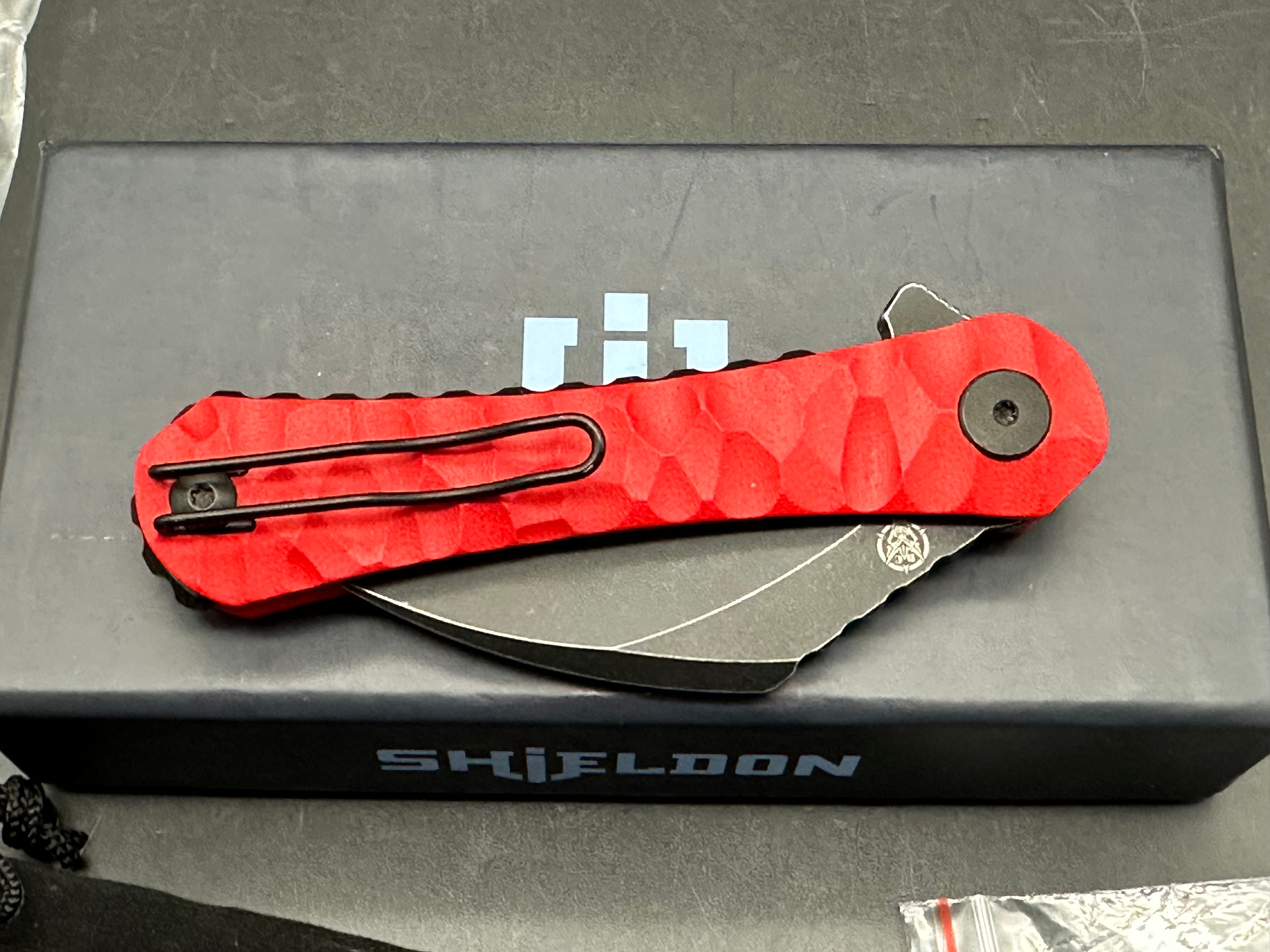 Shieldon Blades Scythe XL folder Blackwash Titanium coated blade of 154CM Red G10 Handle