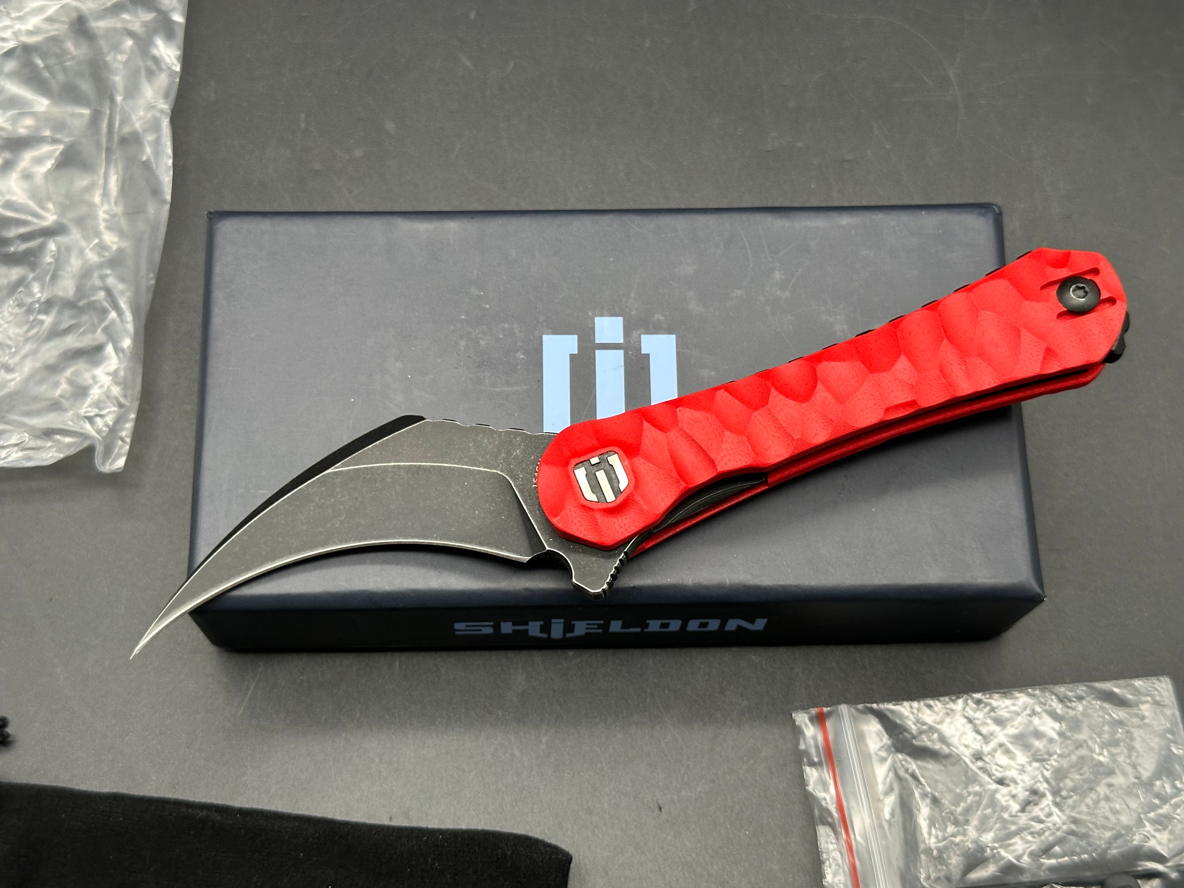 Shieldon Blades Scythe XL folder Blackwash Titanium coated blade of 154CM Red G10 Handle