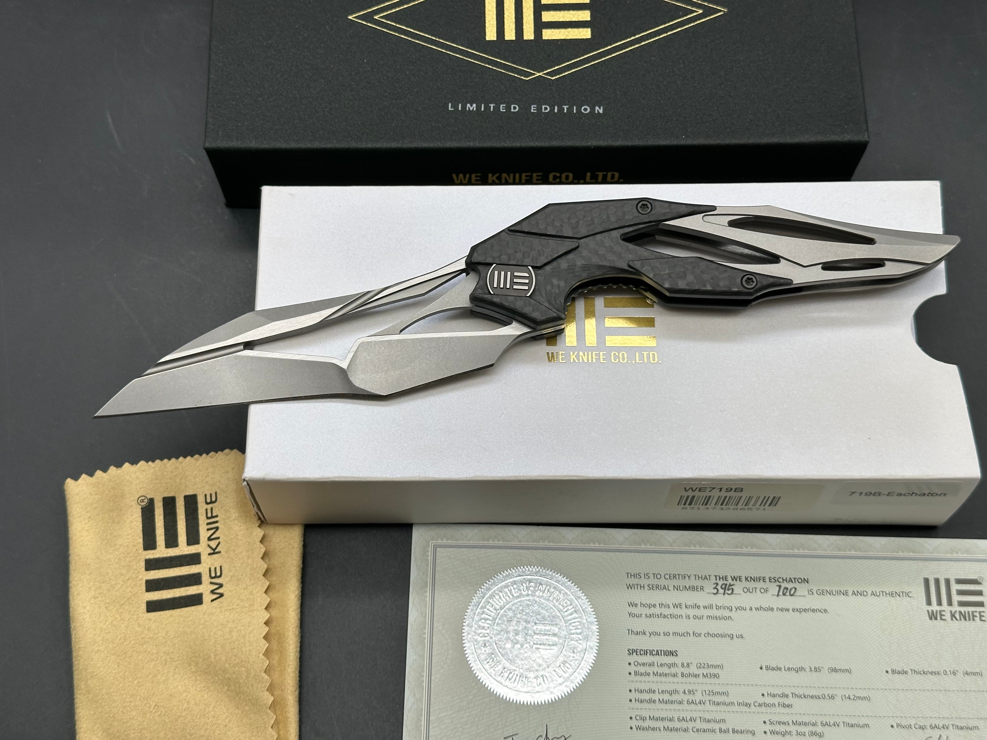 We Eschaton: Elijah Isham design. 3.83 inch, M390, flat grind wharncliffe blade Carbon fiber and titanium handle