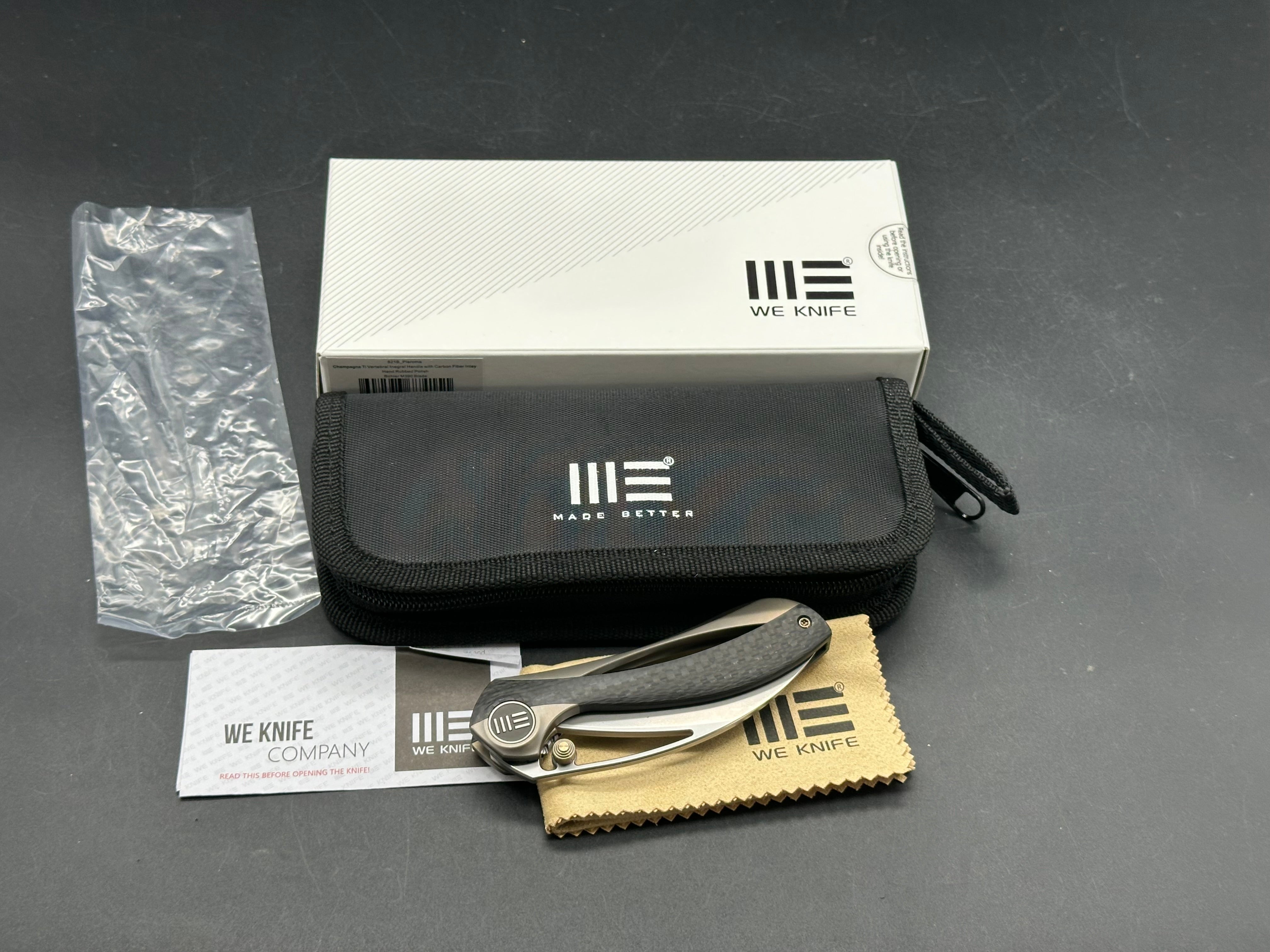 We Pleroma: Elijah Isham design. 2.95 inch M390 Carbon fiber and integral champagne titanium handle
