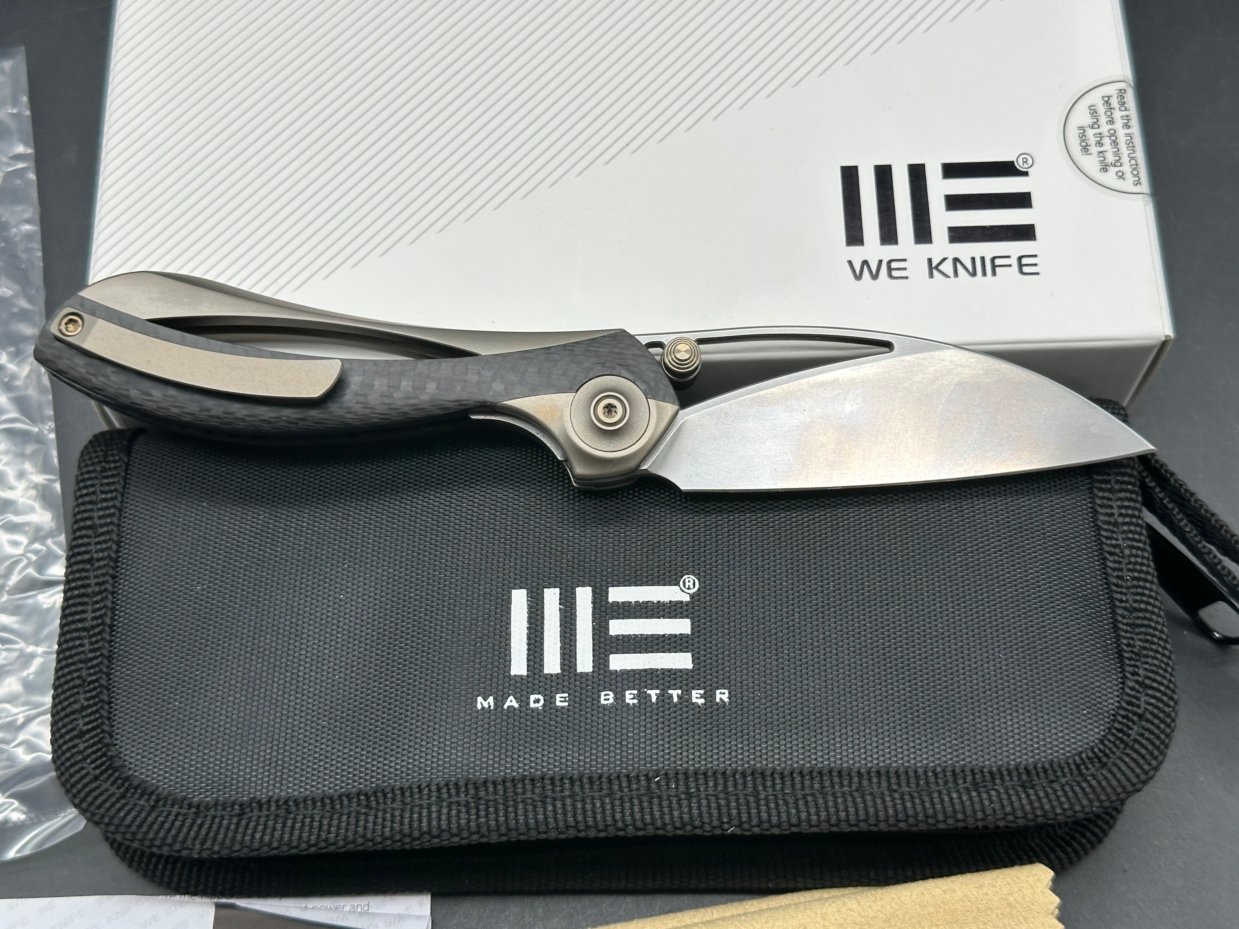 We Pleroma: Elijah Isham design. 2.95 inch M390 Carbon fiber and integral champagne titanium handle