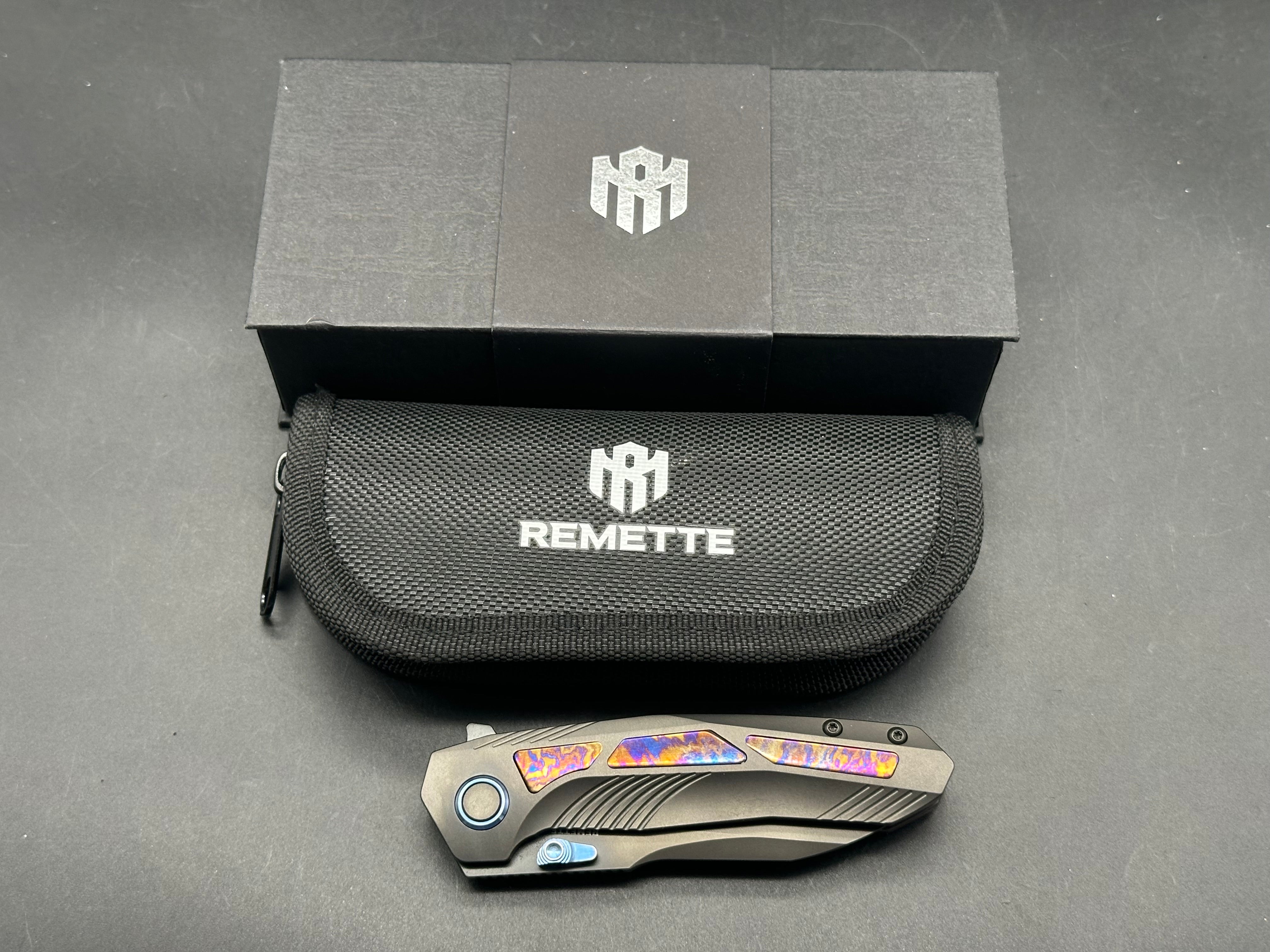 Remette RT-Kestrel with DLC titanium scales with Timascus inlay and clip. DLC S35vn blade