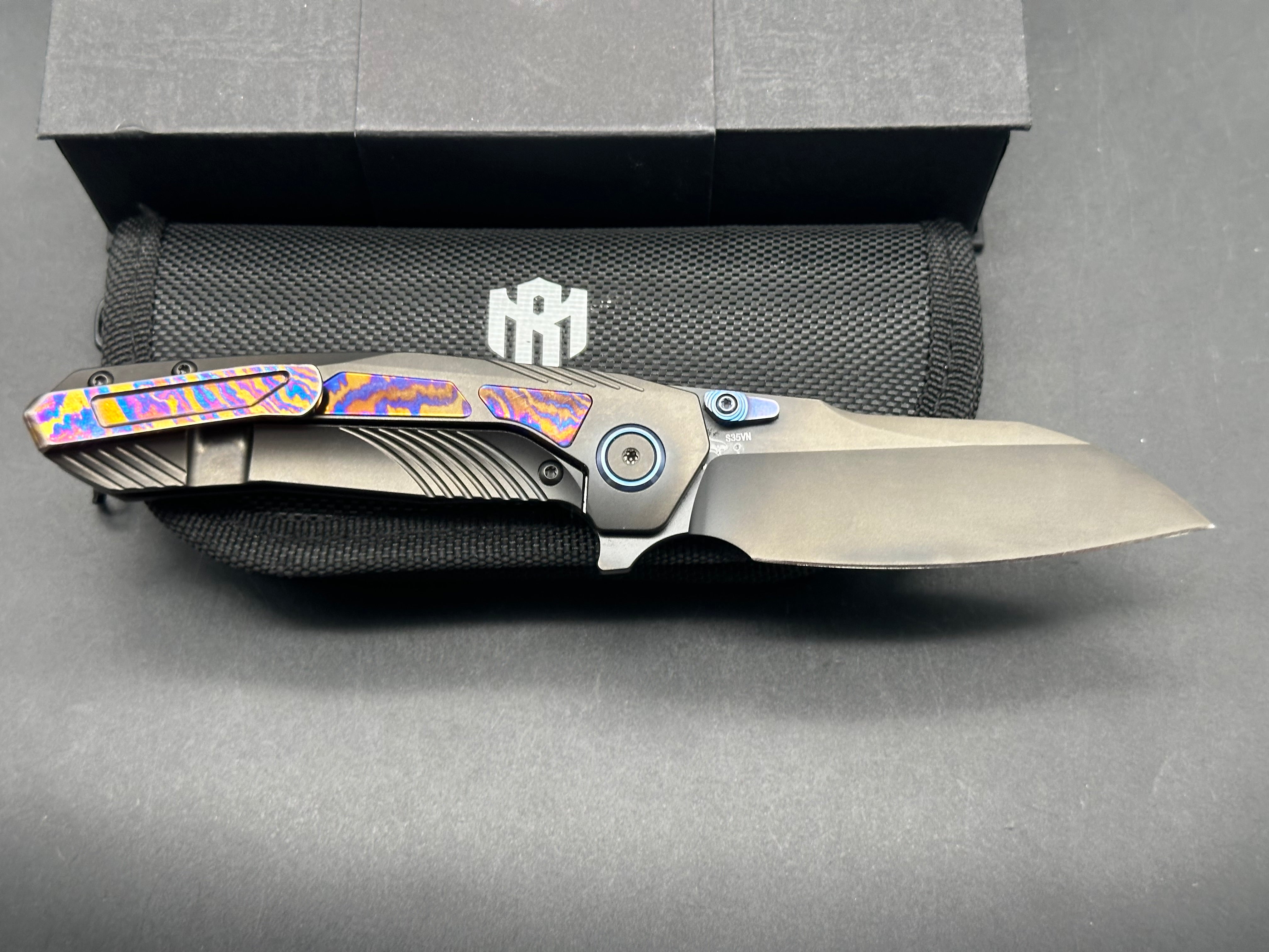 Remette RT-Kestrel with DLC titanium scales with Timascus inlay and clip. DLC S35vn blade