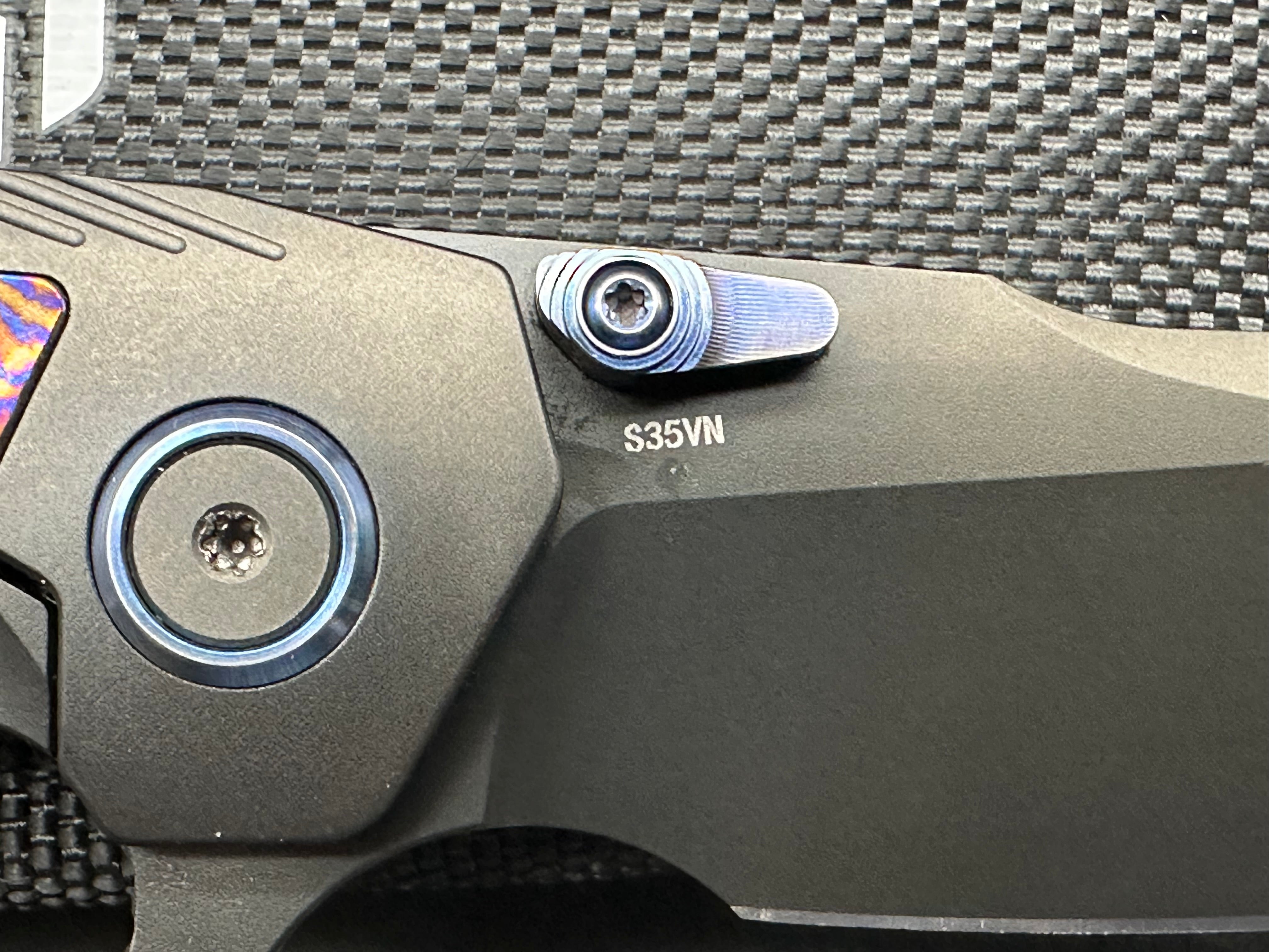 Remette RT-Kestrel with DLC titanium scales with Timascus inlay and clip. DLC S35vn blade