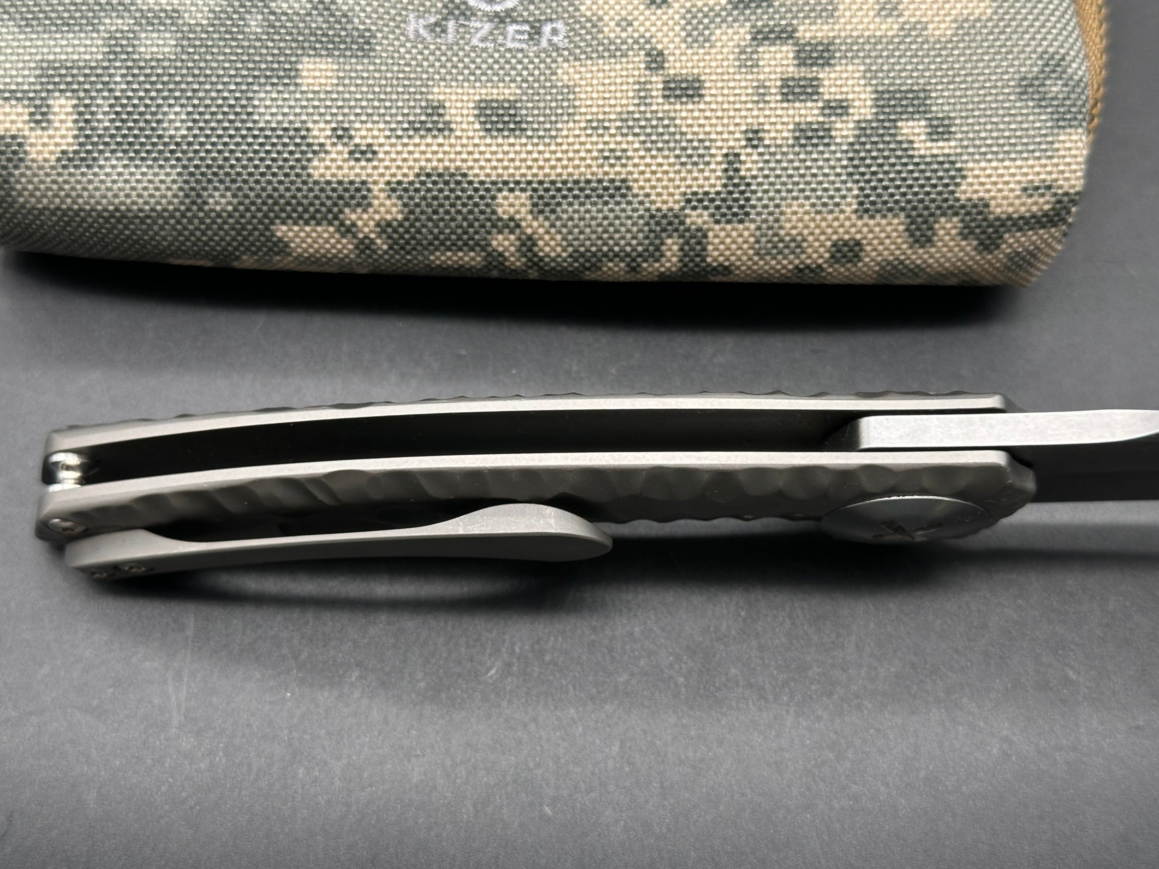 Kizer S.L.T.: John Gray design. 3.5 inch, hollow grind CPM-S35V blade. Frame lock. Titanium handle