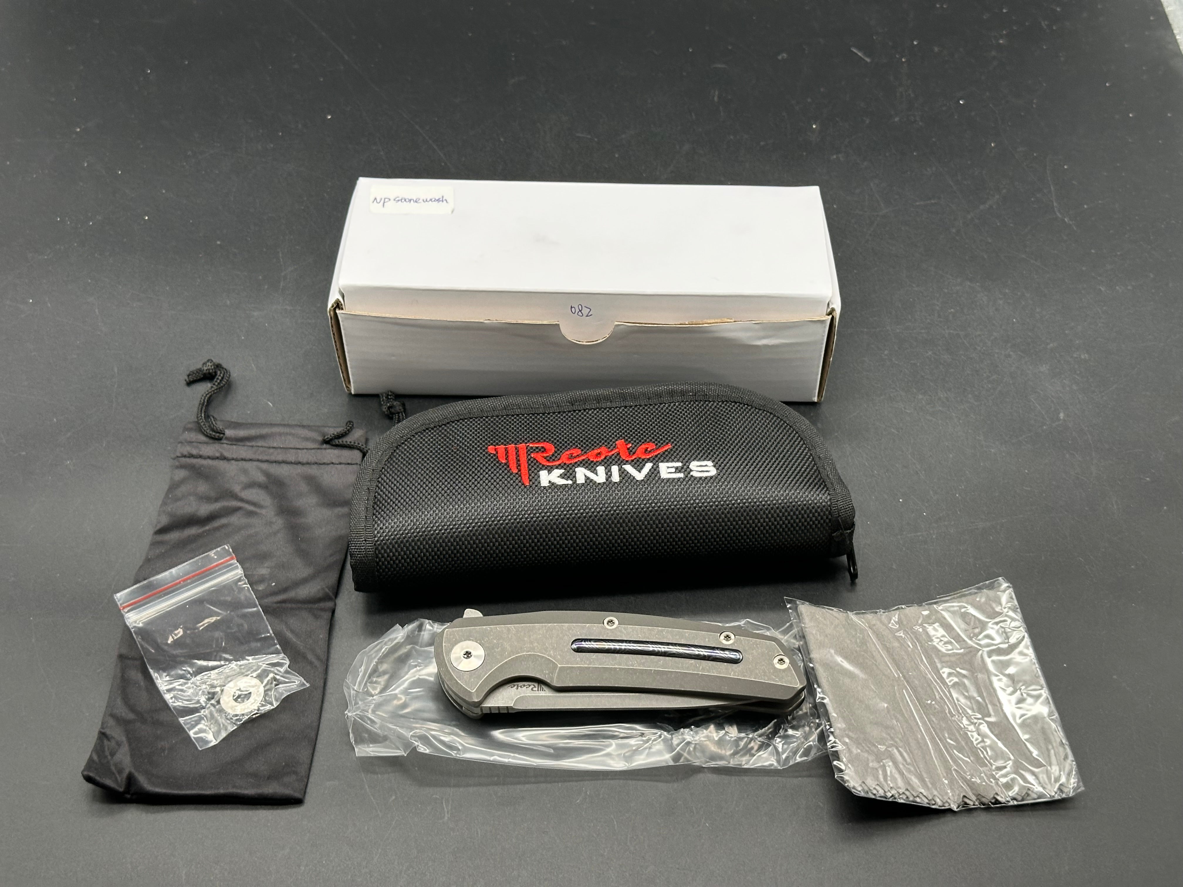 Reate Epoch: 3.75 inch CTS-204P drop point blade. Bead blasted titanium frame with Moku Ti inlay