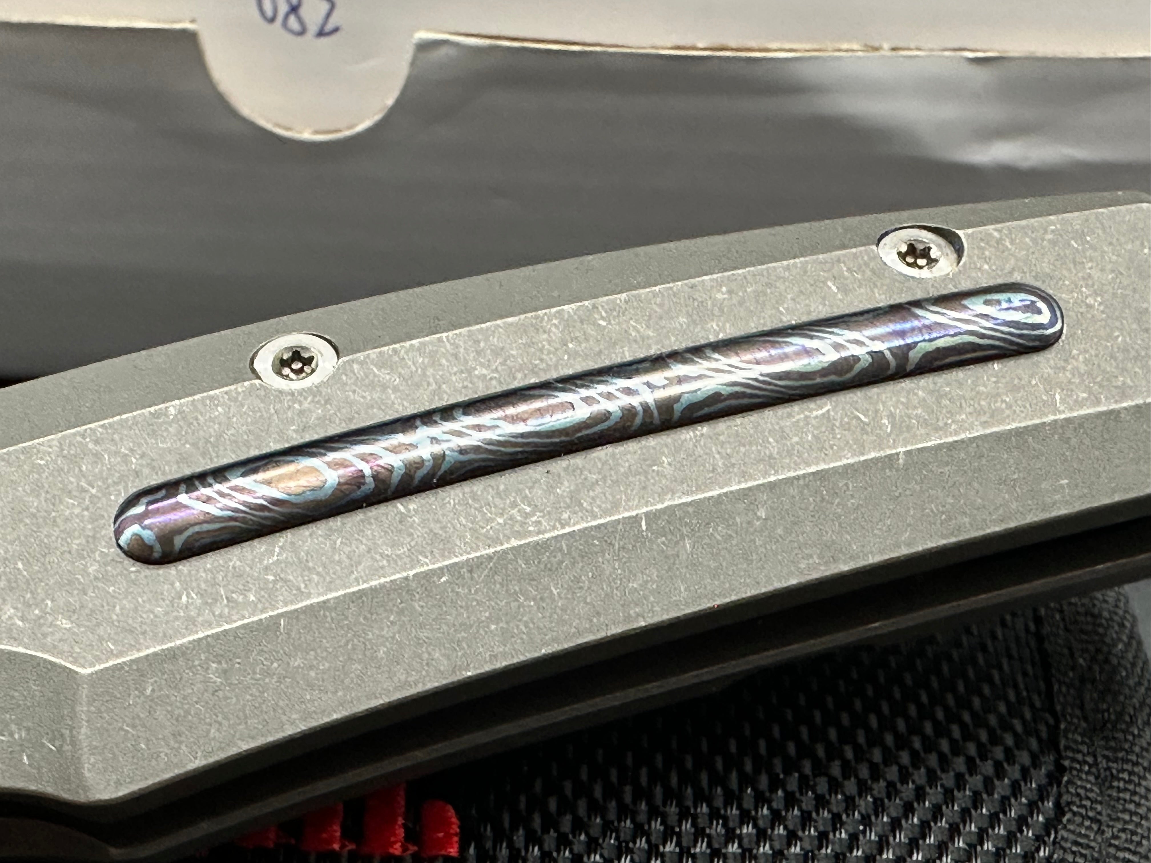 Reate Epoch: 3.75 inch CTS-204P drop point blade. Bead blasted titanium frame with Moku Ti inlay