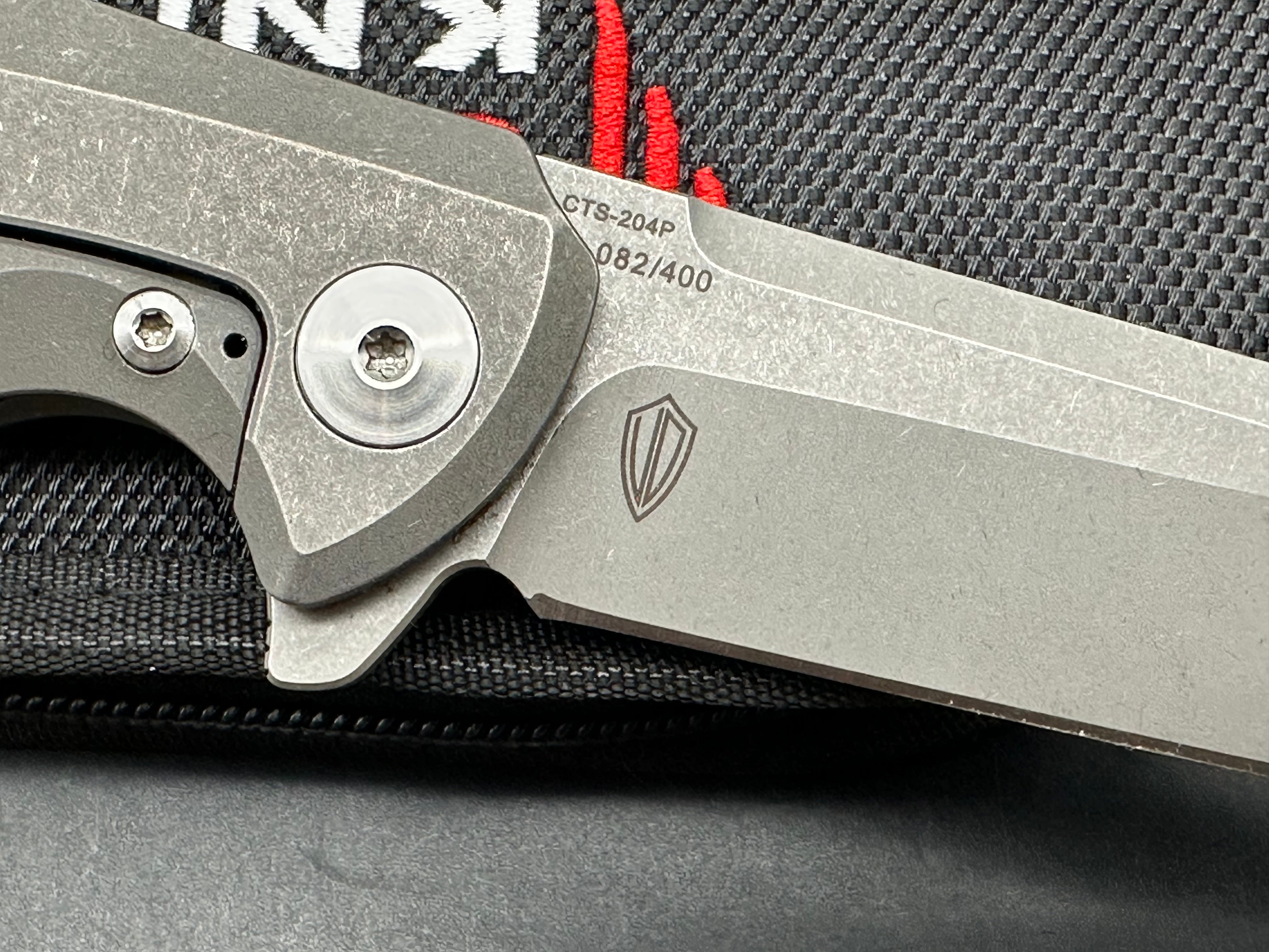 Reate Epoch: 3.75 inch CTS-204P drop point blade. Bead blasted titanium frame with Moku Ti inlay