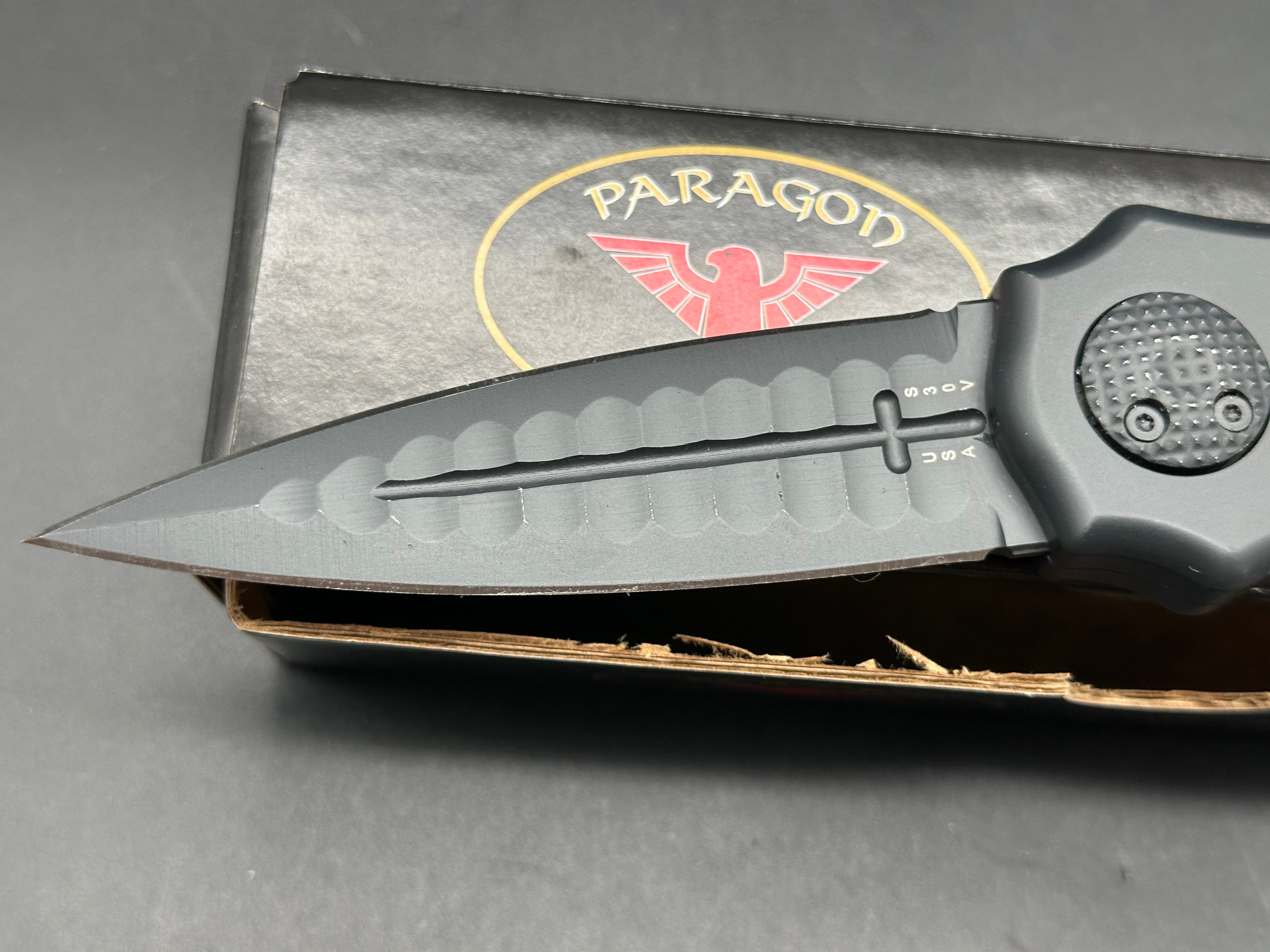 Paragon Warlock: 3.875 inch CPM-S30V blade with double edge. Double pus button split handle opener