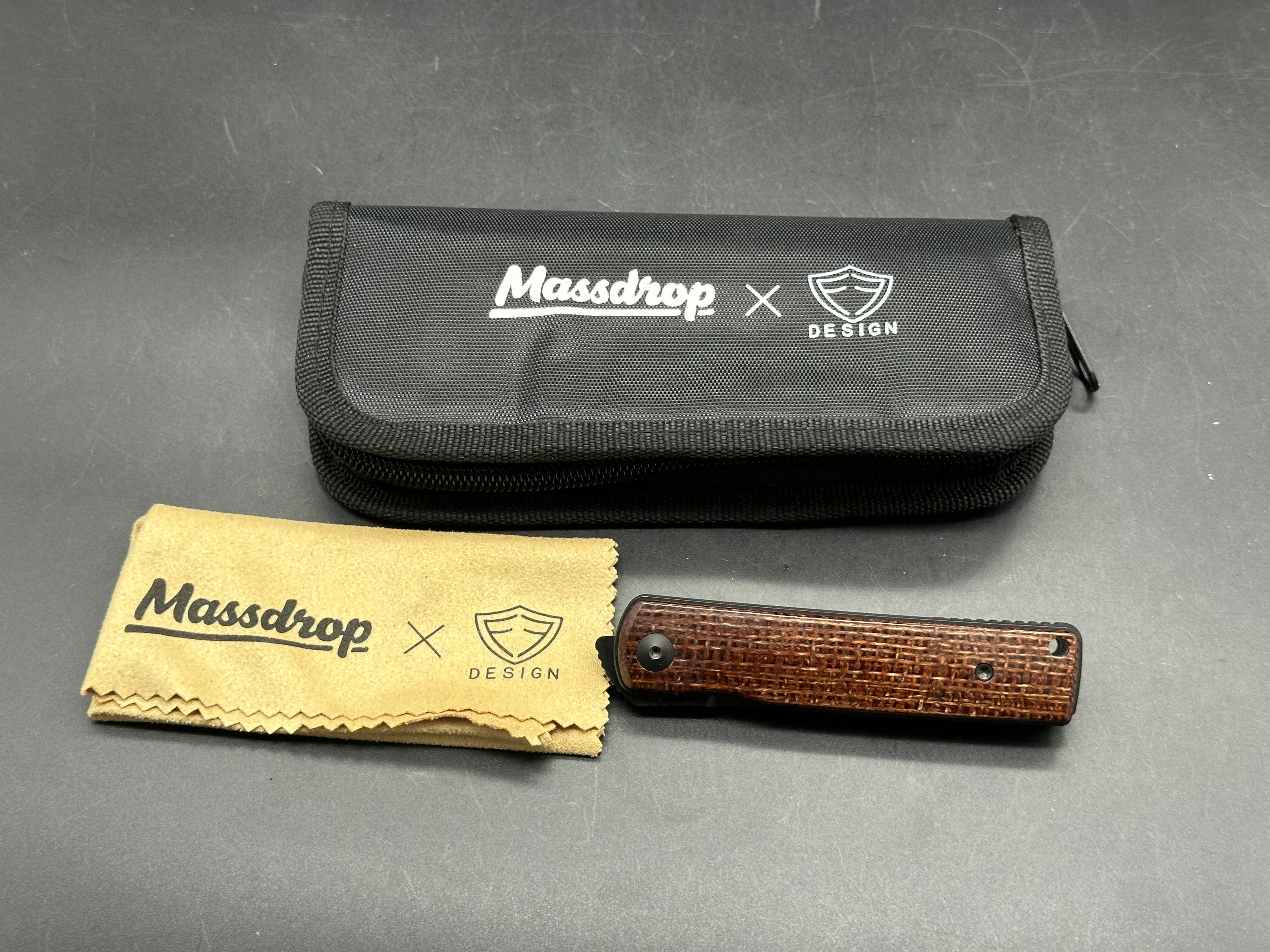 Reate Bushido: 3 inch trailing point, flat grind, blackwash, M390 blade. Front flipper. Blackwash titanium clip. Brown micarta handle