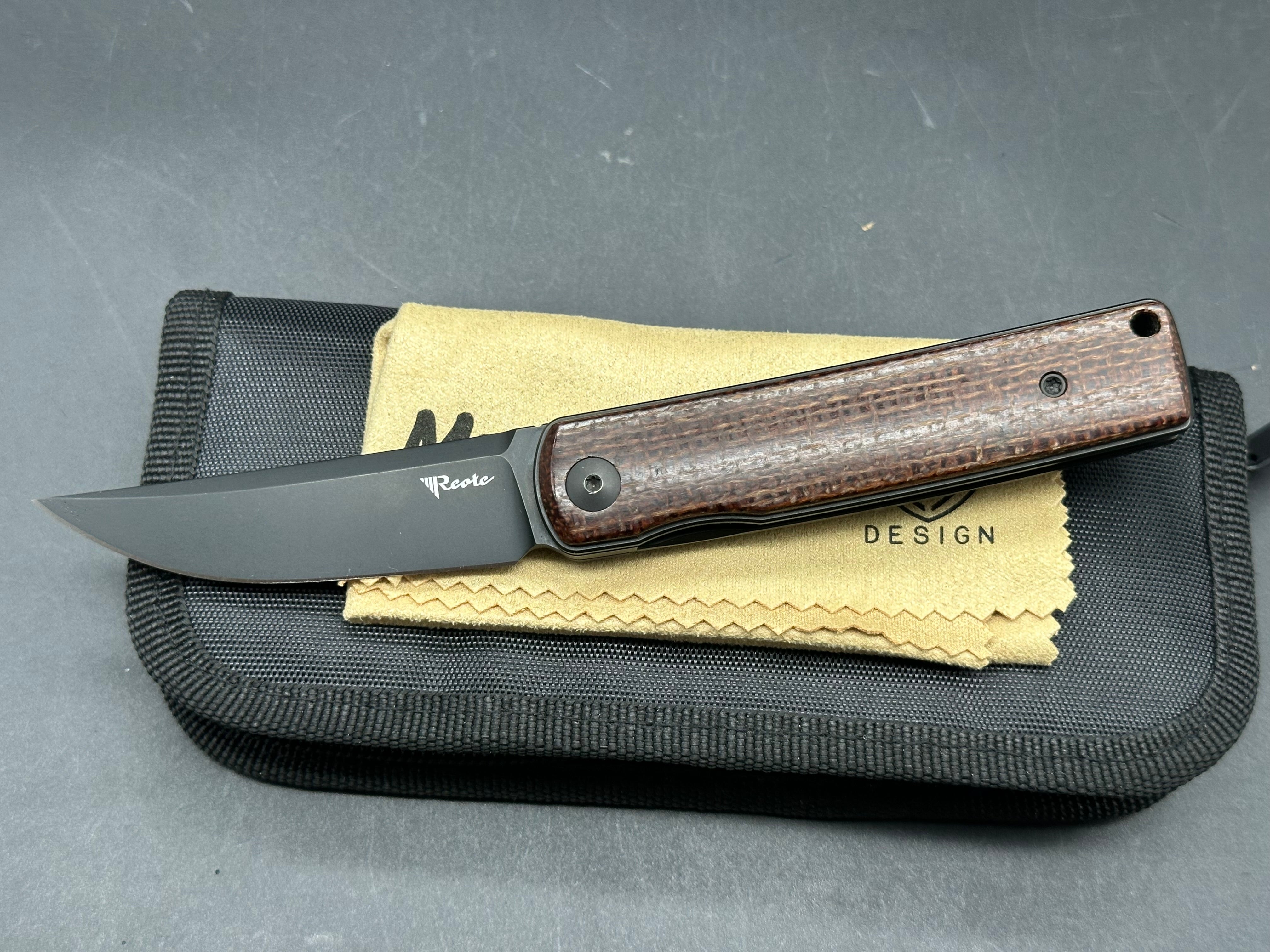 Reate Bushido: 3 inch trailing point, flat grind, blackwash, M390 blade. Front flipper. Blackwash titanium clip. Brown micarta handle