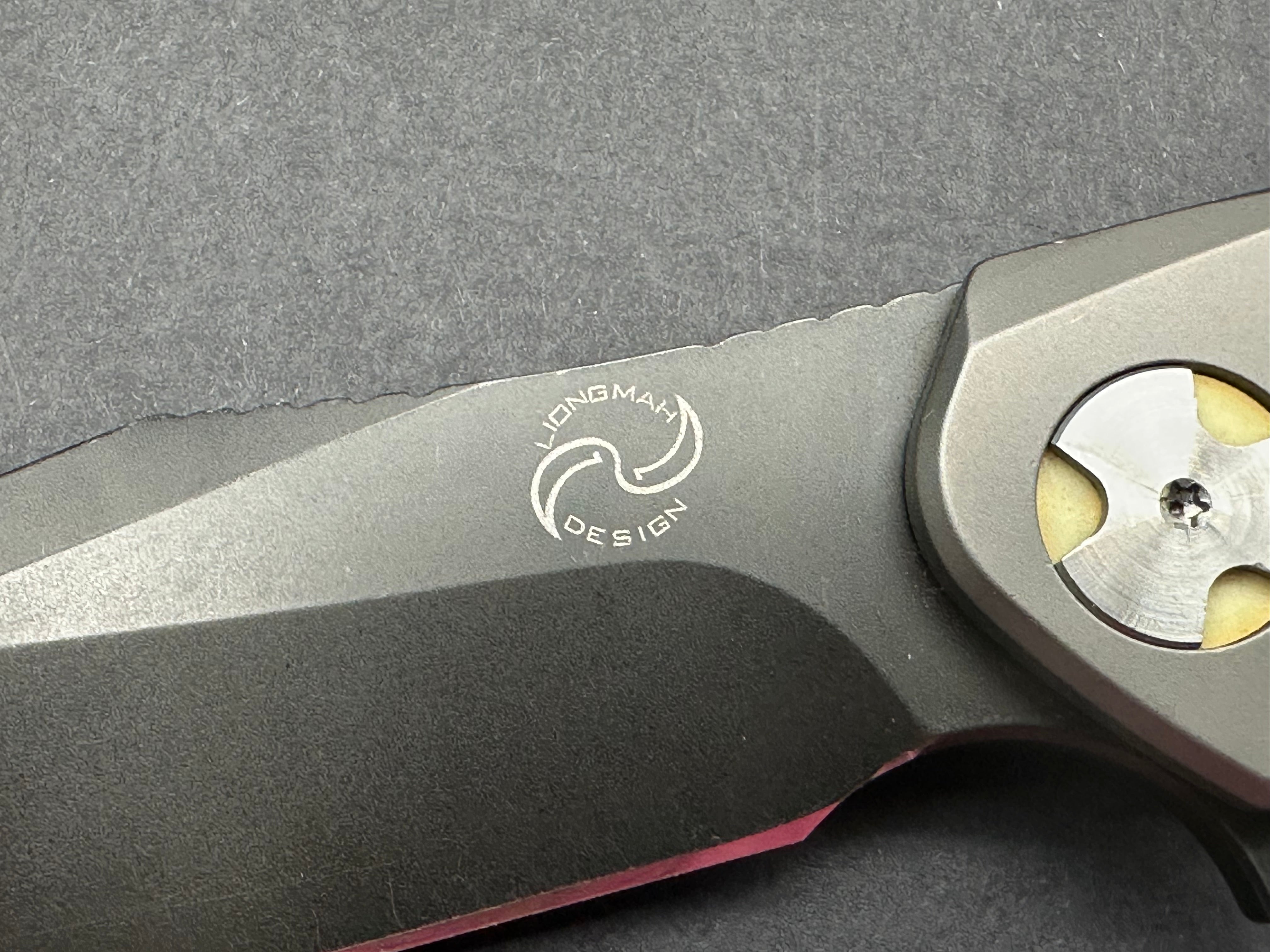 NUK from Liong Mah Designs stainless steel handles, moonglow inserts in the pivot and liners and D2 blade