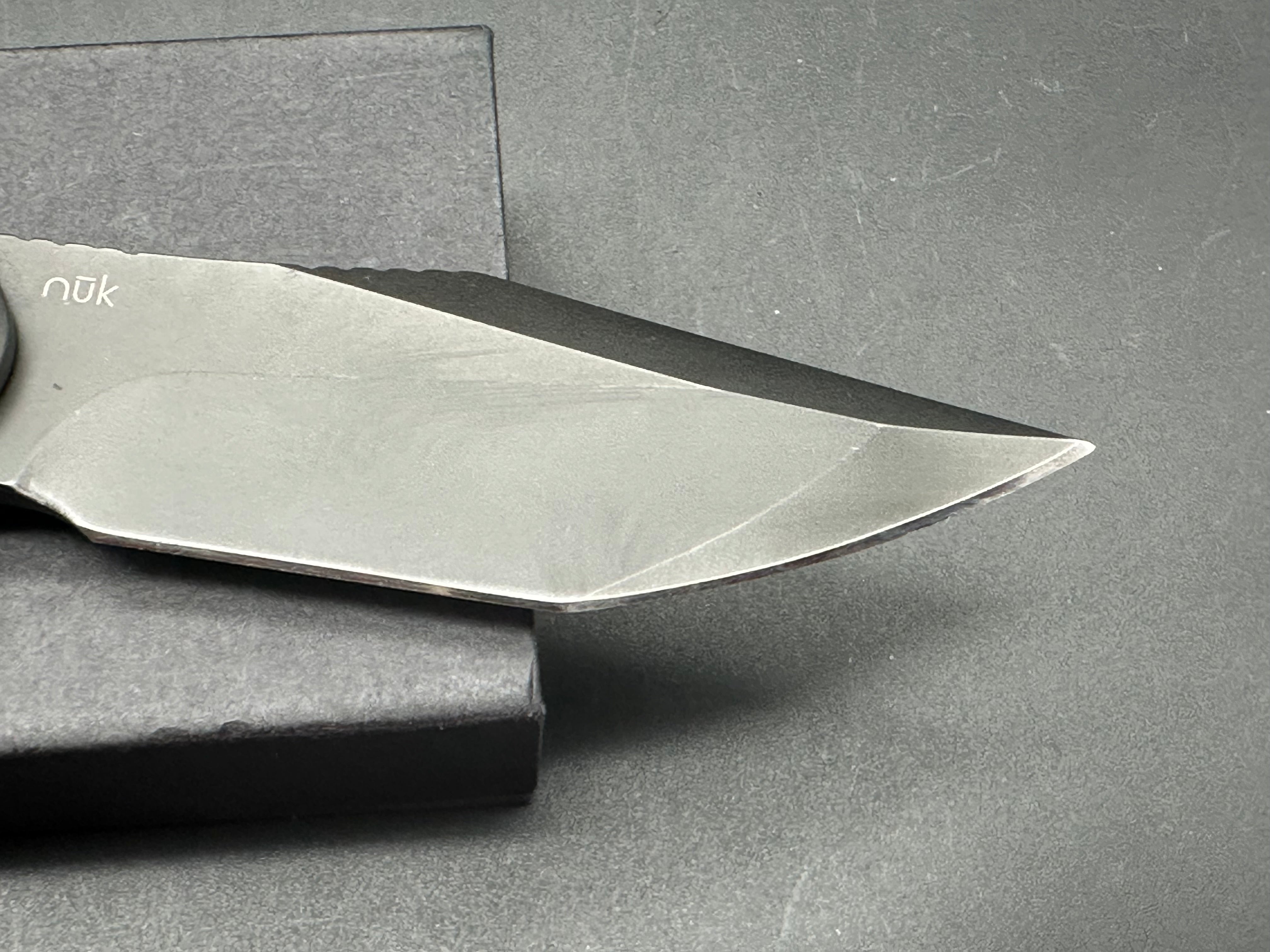NUK from Liong Mah Designs stainless steel handles, moonglow inserts in the pivot and liners and D2 blade