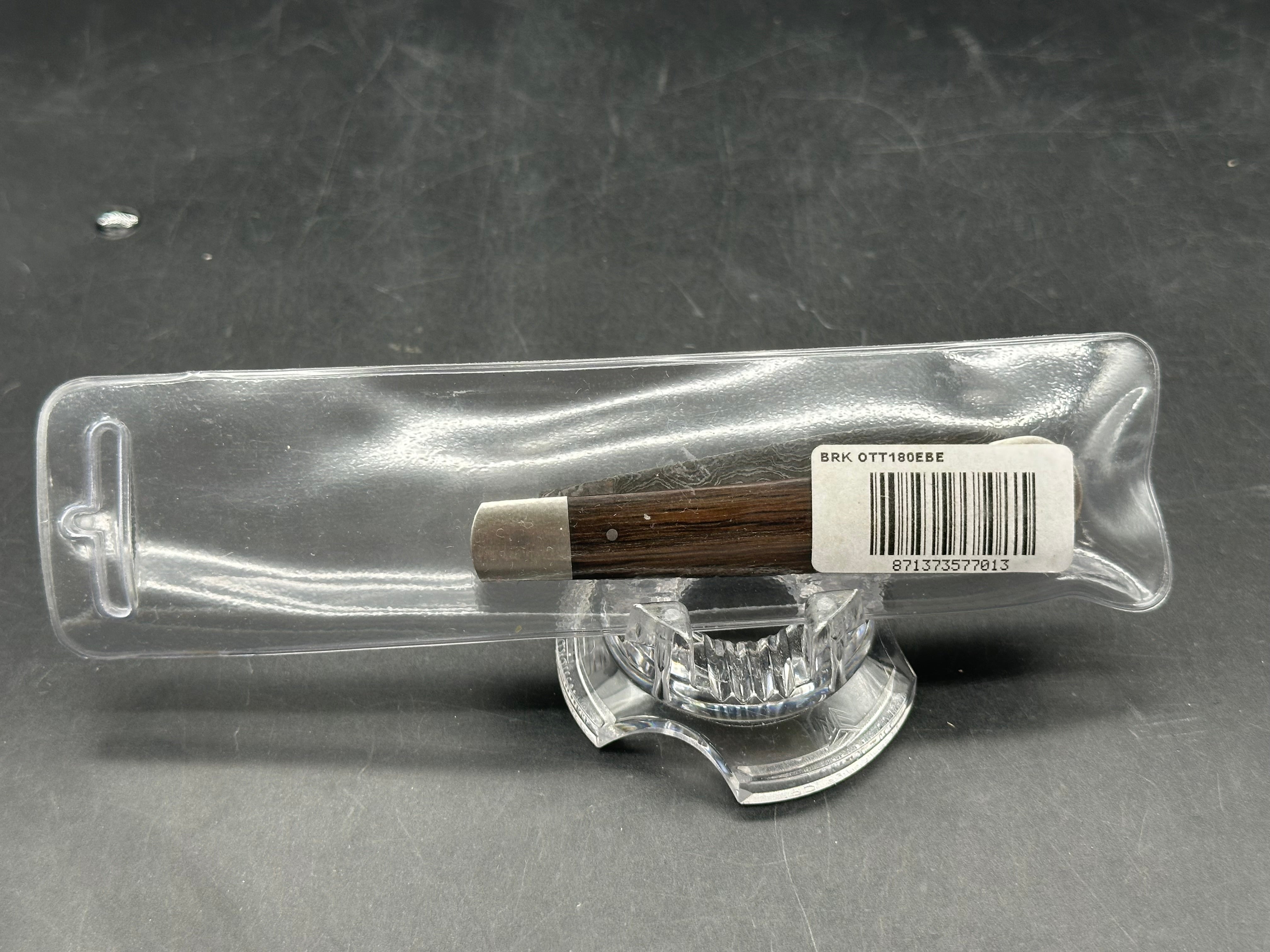 Otter Messer slipjoint with Damascus. Oak covers. 2.95 inch blade