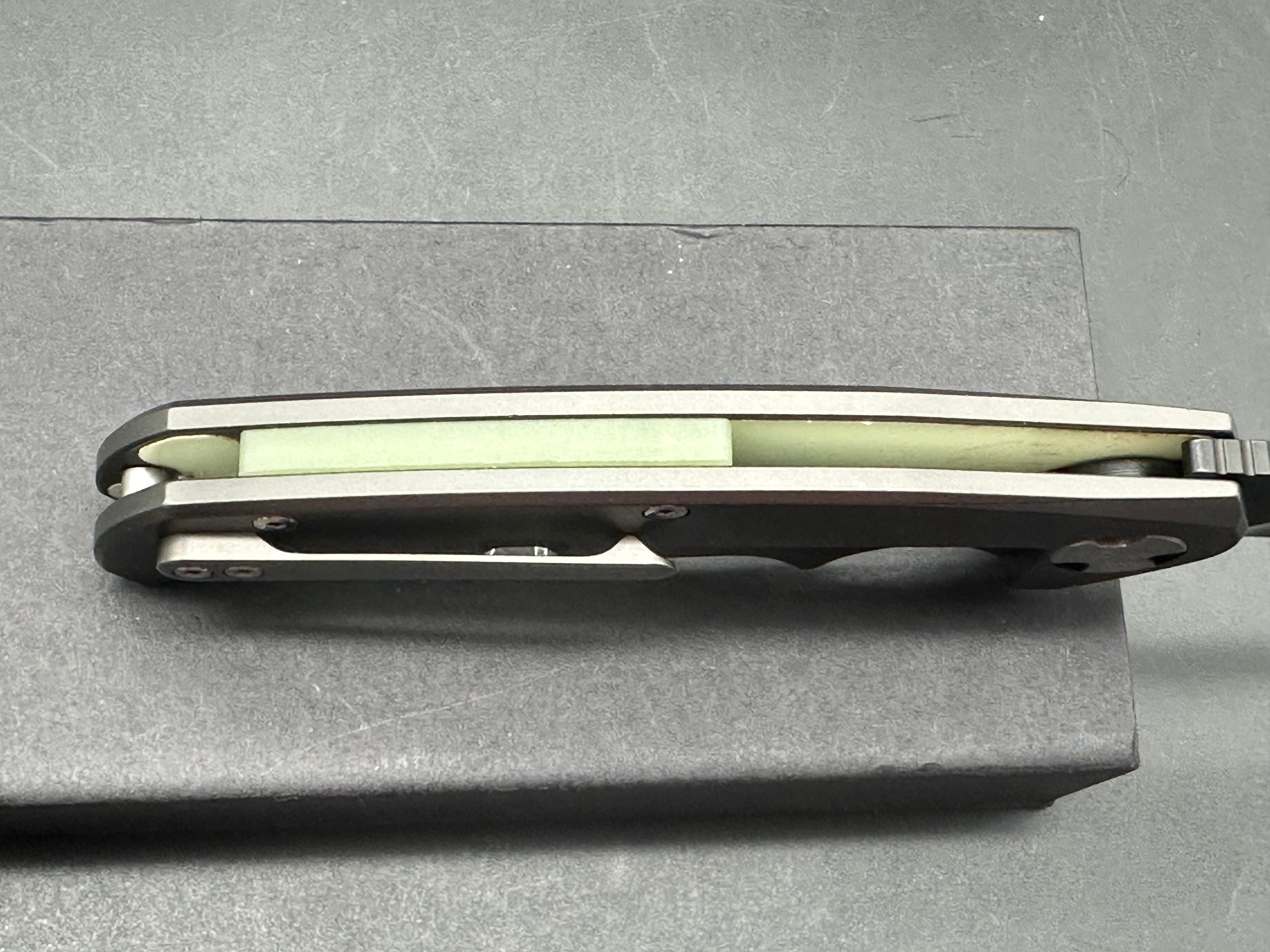 NUK from Liong Mah Designs stainless steel handles, moonglow inserts in the pivot and liners and D2 blade