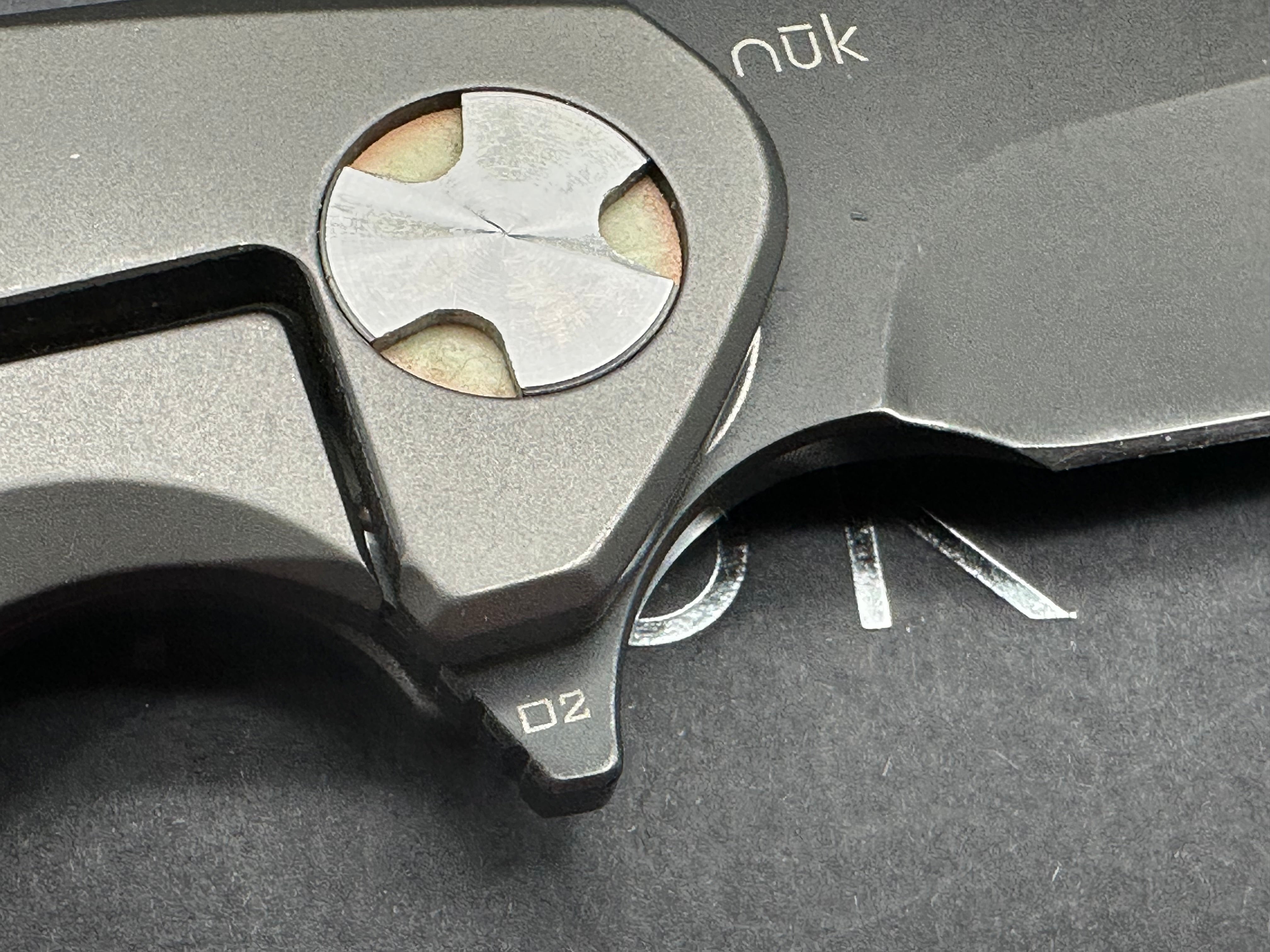 NUK from Liong Mah Designs stainless steel handles, moonglow inserts in the pivot and liners and D2 blade