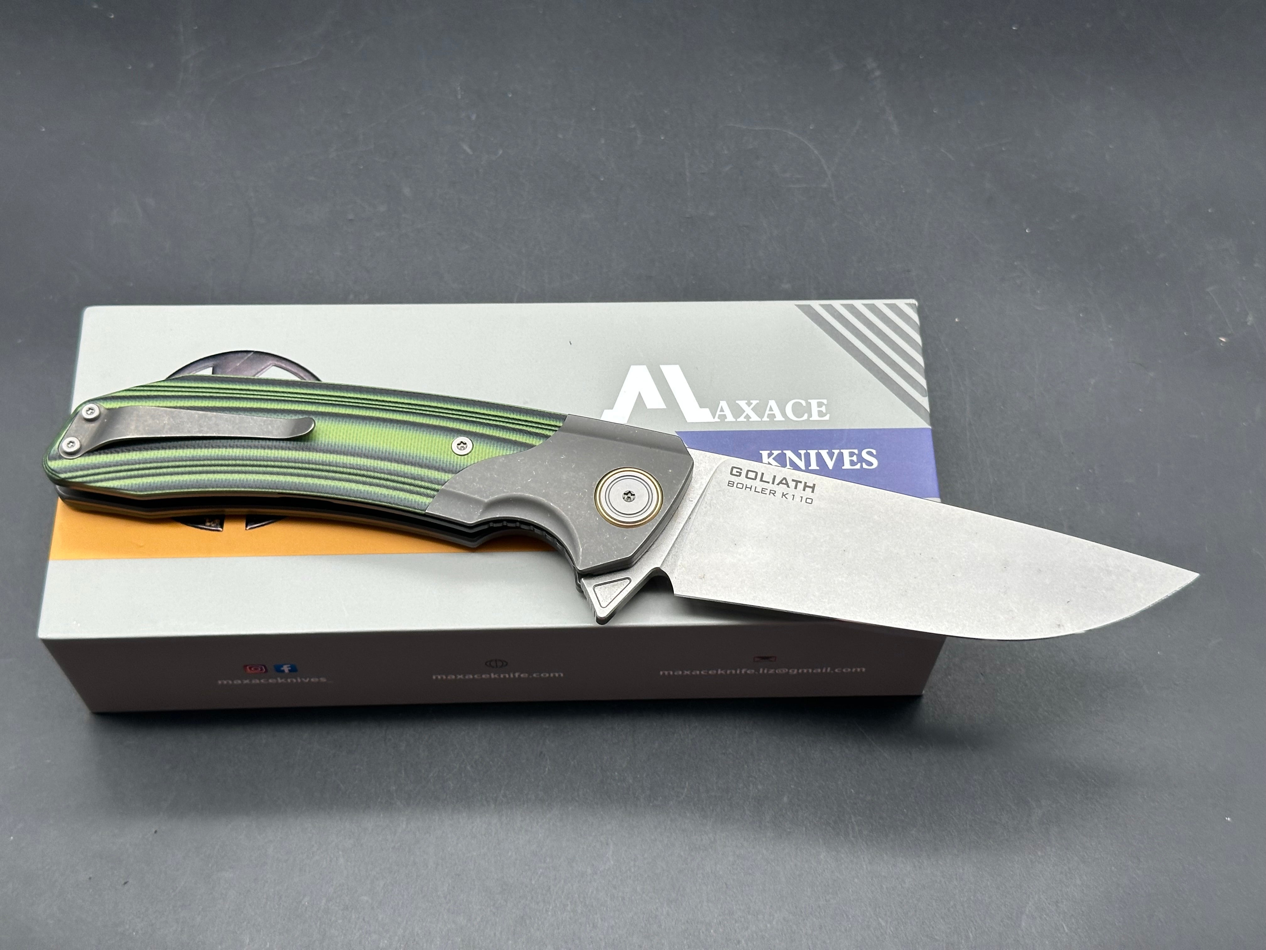 Maxace Goliath 2.0 Bohler K110 stainless blade. Green & Black G10 handle. Titanium bolsters