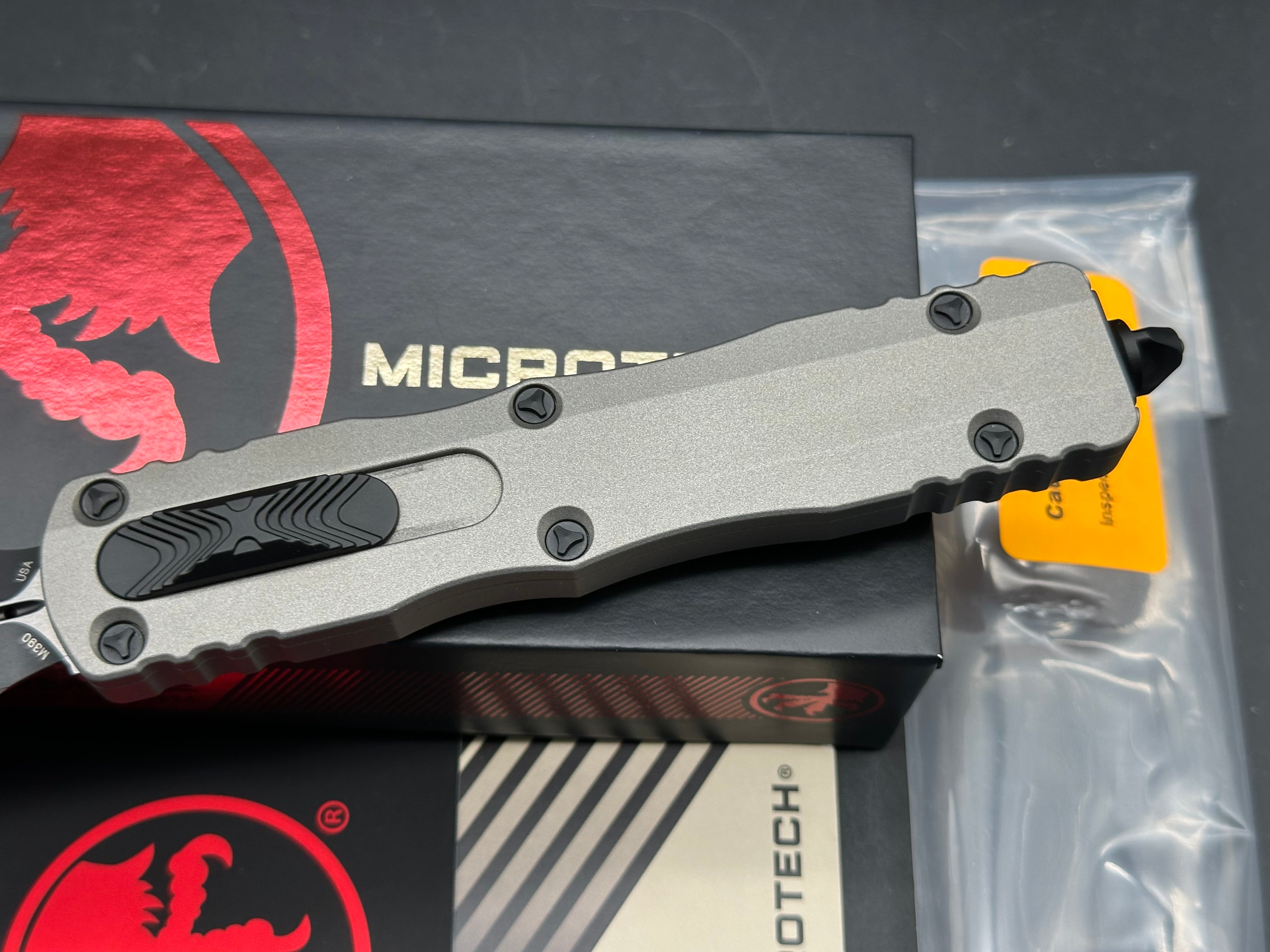 Microtech 227-1TG Dirac Delta AUTO OTF Knife 3.79" Black Double Edge Dagger Blade, Titanium Gray Aluminum Handles