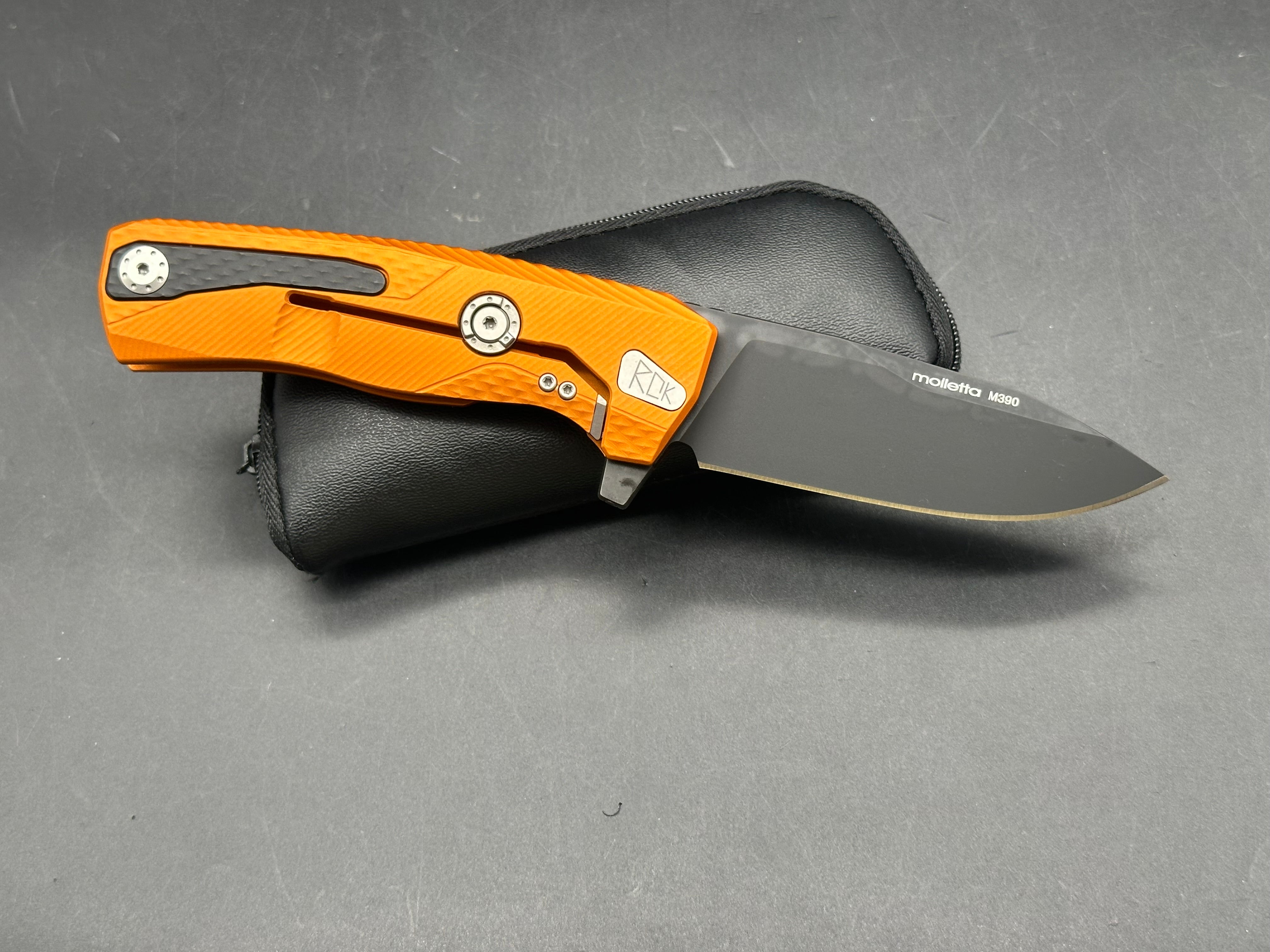 Lionsteel ROK Orange Anodized Aluminum Handle Bohler M390 Black (3.25” DP) Blade