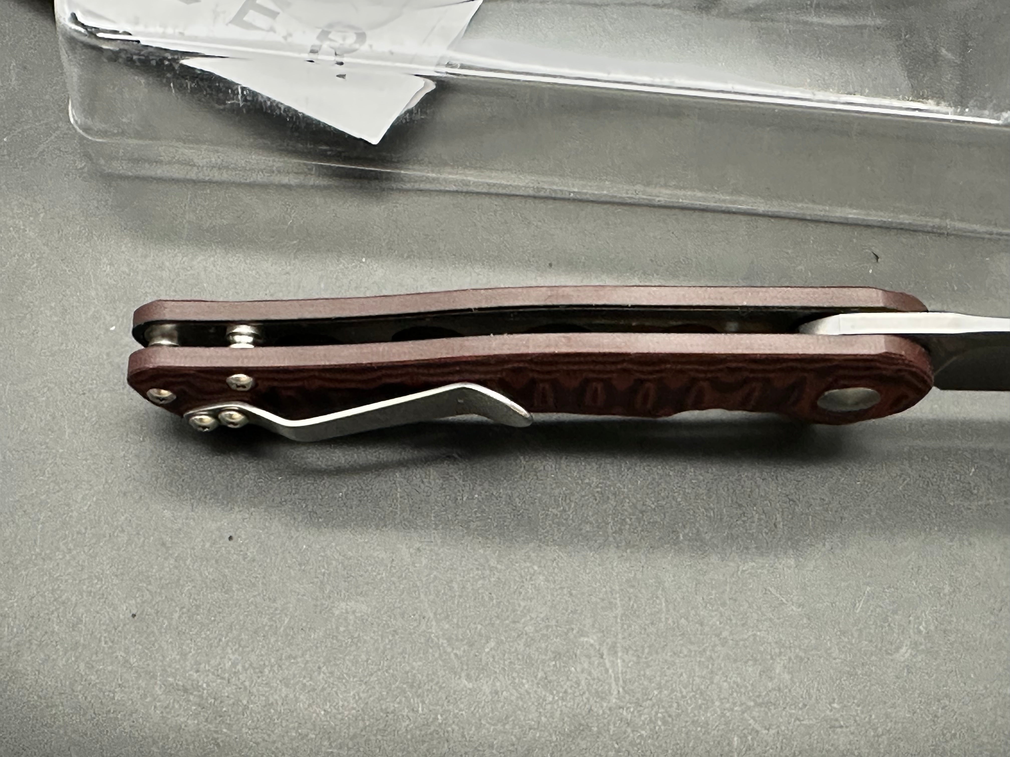 Kizer Dukes A2: Matt Cucchiara design. 3 inch drop point, hollow grind VG-10 blade. Red G-10 handle