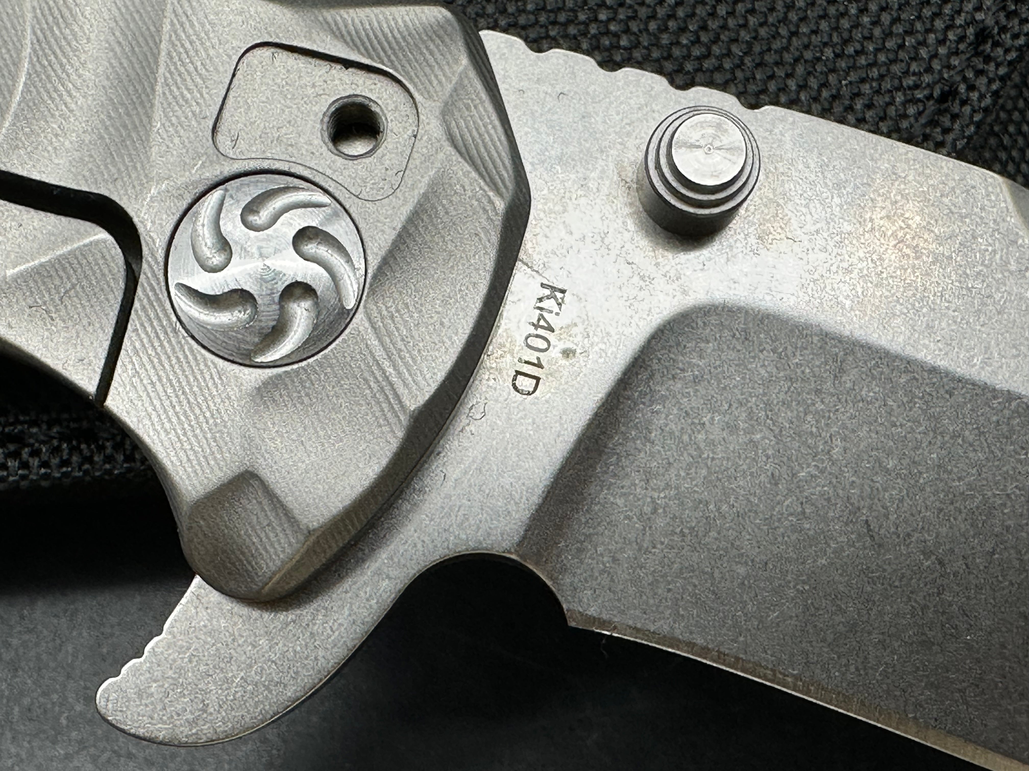Kizer Caligine 3.58 inch stonewash, drop point, flat grind CPM-S35VN blade. Frame lock. Titanium handle. Titanium clip