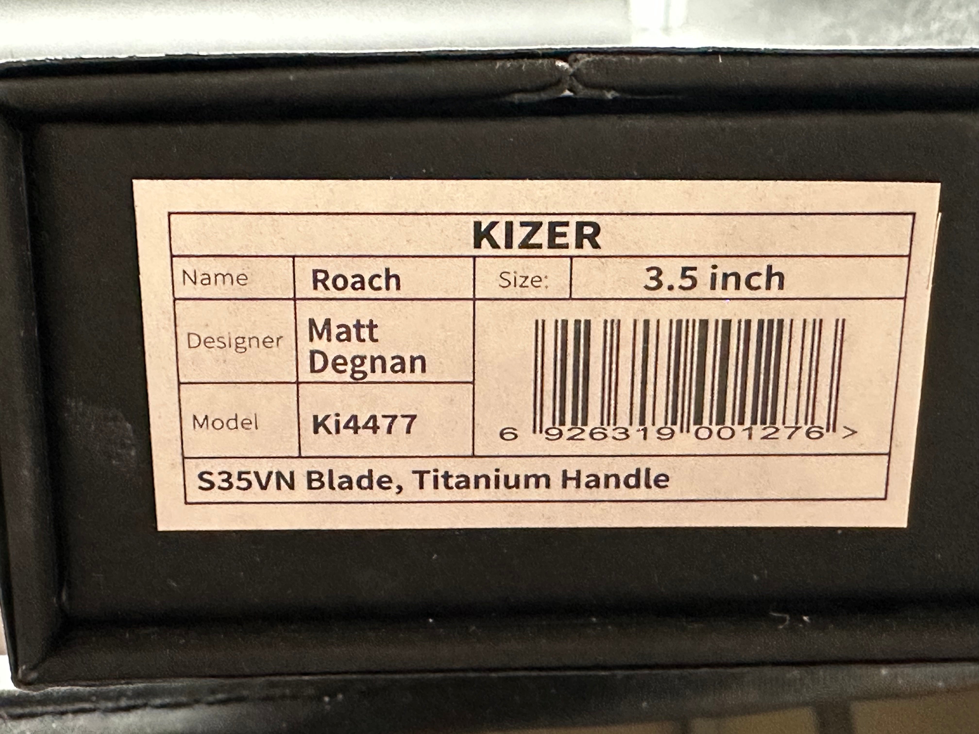 Kizer Roach Matt Degnan design 3.5 inch drop point flat grind, satin CPM-S35VN blade Titanium scales and clip with Roach insignia