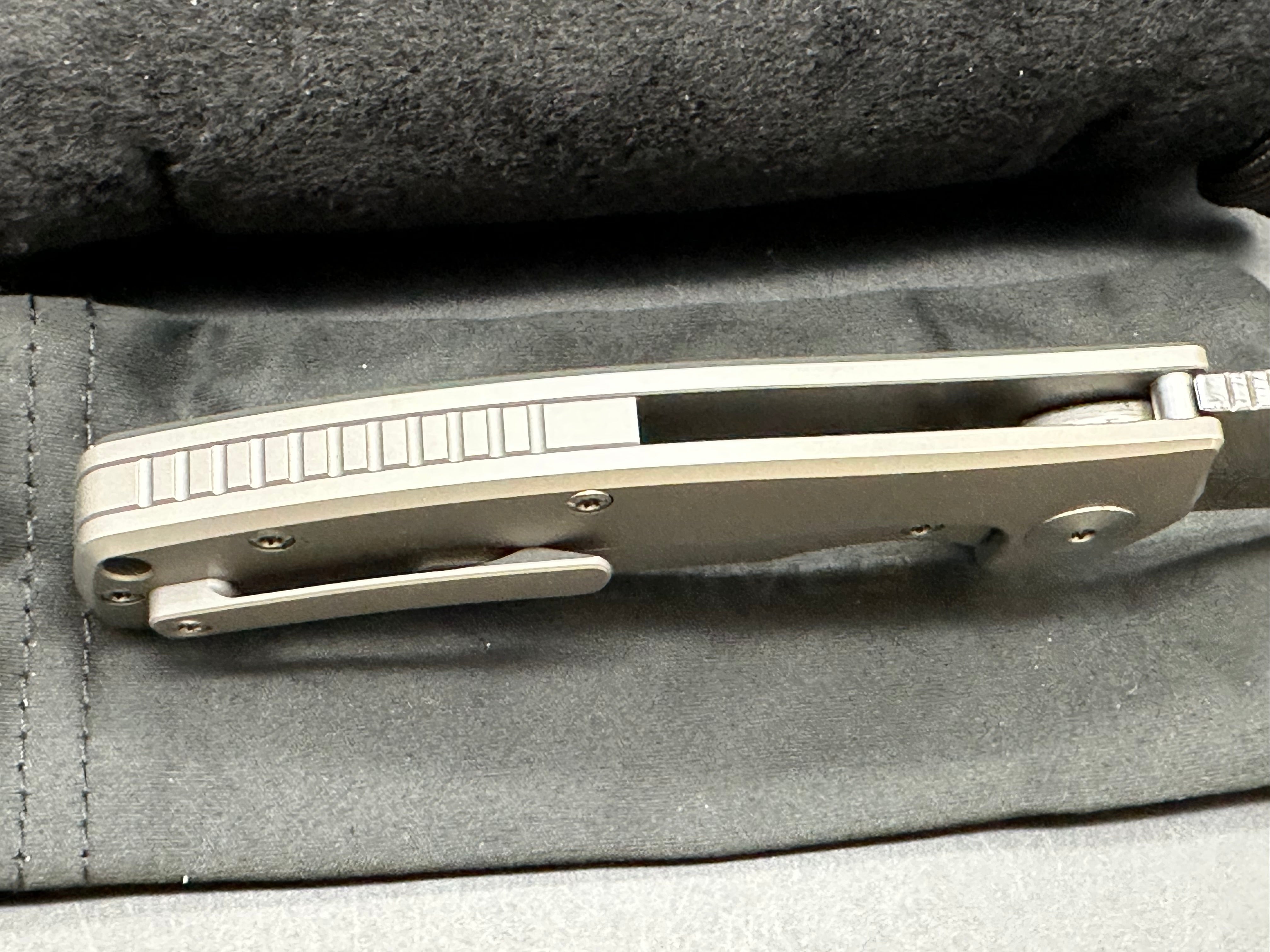 Reate Mini Horizon D: 3.5 inch drop point Damascus blade. 3D machined titanium handle with carbon fiber inlay