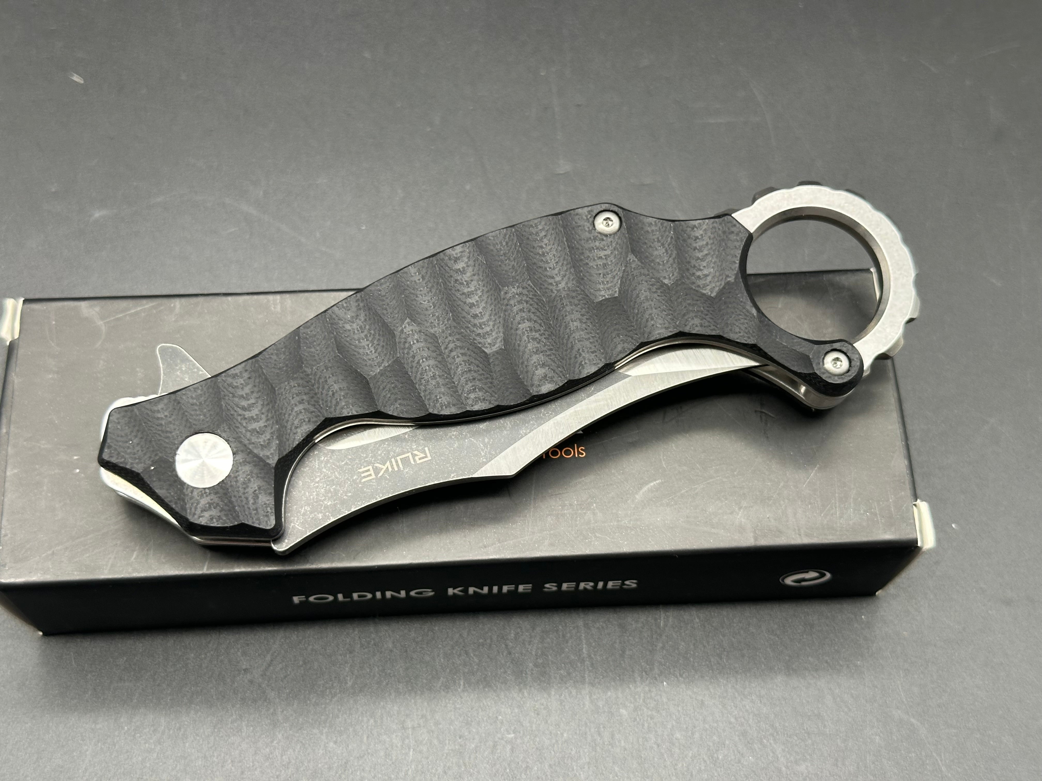 RUIKE P881 BLACK TEXTURED G10 HANDLE BLACK PLAIN EDGE